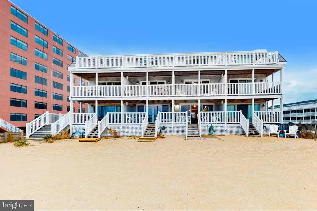 Rarely available oceanfront property with direct beach access, offering 4 bedrooms and 2.5 bathrooms in an exceptional coastal setting. Step from one of three oceanfront decks directly onto the sand, enjoy your morning coffee as the sun rises over the ocean, or unwind by the community pool—this is effortless beachfront living at its finest. Ideally located in the heart of Ocean City, just a short walk to dining, shopping, and local attractions.

The home has been thoughtfully updated throughout, featuring a fully renovated kitchen and bathrooms, upgraded electrical systems, a refreshed outdoor shower, and fully replaced exterior decking, including the beachfront stairs.

Offered beautifully furnished, this property conveys turn-key and is ready for immediate enjoyment and income generation. With a strong rental history up to over $70,000 annually, and over $35,000 in confirmed bookings for the 2026 summer season, (which buyers must honor), it presents a compelling investment opportunity for future owners. Pre-inspected for added buyer confidence.  No special assessments currently planned (buyers to confirm).
