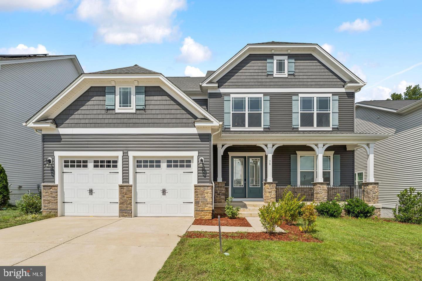 Step into modern elegance at 58 Boxelder Drive, a beautifully designed 2023 home in Stafford's highly sought-after Embrey Mill community. Offering over 4,200 square feet of thoughtfully crafted living space, this home welcomes you with a bright, open-concept floor plan filled with natural light. Designed for today's lifestyle, the main level offers the flexibility for a potential fifth bedroom, making it ideal for guests, a home office, or multi-generational living.

At the heart of the home is a gourmet kitchen featuring granite countertops, a gas cooktop, double wall ovens, an oversized center island, and abundant cabinetry—perfect for everyday living and effortless entertaining.

Upstairs, the luxurious owner's suite serves as a private retreat with a spa-inspired bath and an expansive walk-in closet. A secondary bedroom features its own private en-suite bathroom, while the third and fourth bedrooms are connected by a convenient Jack-and-Jill bathroom, providing both privacy and functionality for family or guests.

The finished walk-out basement extends the living space with a large recreation room, a full bathroom, and a versatile bonus room offering the potential for a sixth bedroom, home gym, office, or media room . Natural light and direct access to the backyard make this level as inviting as the rest of the home.

Additional highlights include a fenced backyard, smart home features, EV charging capability, and a two-car garage. Residents enjoy exceptional Embrey Mill amenities, including resort-style pools, scenic walking trails, playgrounds, parks, a clubhouse, fitness facilities, and convenient access to I-95, Quantico, shopping, dining, and highly rated Stafford County schools.