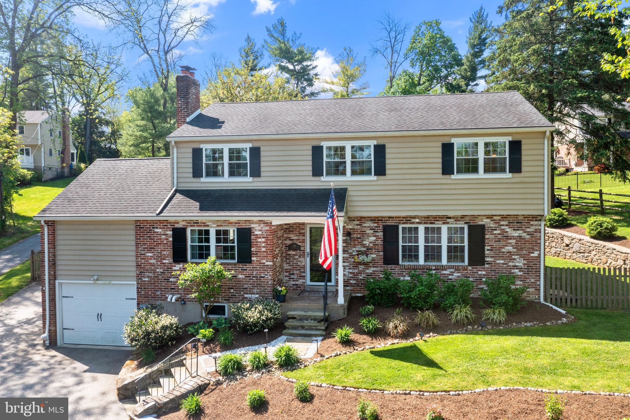 Welcome to 441 Iven Avenue, walk to Wayne.  "Welcome Home" never felt so amazing. This meticulously maintained 4 bedroom/ 3 .5 bath Colonial is adorned with modern updates . The thoughtfully designed space exudes sophistication, charm, and pride. The living room is inviting and draws you into the warmth and comfort, complements of the gas fireplace, custom built-ins, and an exposed beam. The family room, bathed in natural light, is bright and captivating for everyday living as well as entertaining. The refined kitchen, featuring shaker cabinets, stainless steel appliances, and modern finishes, is truly the heart of the home. The kitchen seamlessly connects to both the breakfast nook and formal dining room. The formal dining room caters to intimate dinners or social gatherings versatile enough for any occasion. Through the French doors, the sunroom greets you with a charming exposed brick wall, creating a cozy atmosphere. The mudroom, powder room, and laundry area are tucked away on this level for your convenience. Upstairs, retreat to the master bedroom suite with a natural and soothing ambiance. The ensuite bath features a dual vanity sink and a frameless glass shower, creating a rejuvenating experience. On this level, there are two additional sizable bedrooms sharing a hall bath. Tucked away at the end of the hall, is a fourth bedroom with an ensuite bath. The finished basement adds an additional 675 square feet of living area. Outside, the paver patio and two-tiered fenced-in backyard provides the perfect setting for al fresco dining or your favorite yard game. Additional features include gorgeous hardwood floors throughout, a one-car attached garage, and an outdoor shed. With its convenient proximity to downtown Wayne, The Radnor Trail, and Enke Park, 441 Iven Avenue offers a perfect blend of modern comfort and classic allure.