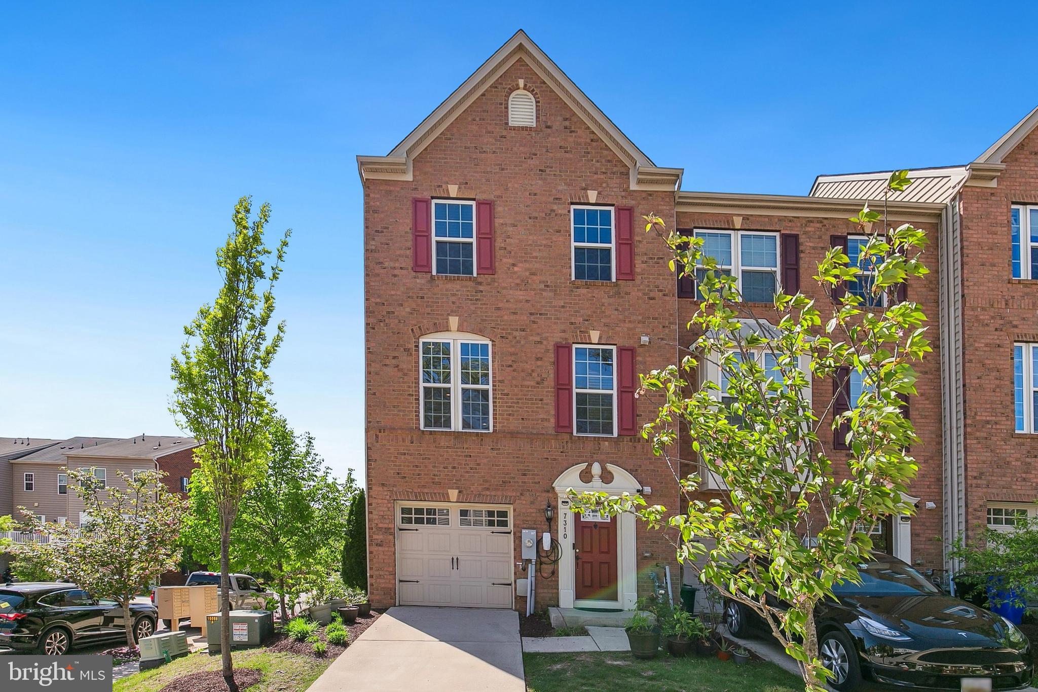 Experience refined living in this impeccably maintained three-story garage townhome, nestled in a serene, park-like community. The entry-level welcomes you with a flexible space—ideal as a fourth bedroom, private guest suite, or recreation room—featuring its own full bath and private rear entrance for added convenience and privacy.

The main level exudes warmth and sophistication with rich engineered hardwood floors and an expansive living area designed for both comfort and entertaining. A thoughtfully appointed chef’s kitchen showcases gas cooking, generous counter space, and an inviting dining area that opens to a sleek, maintenance-free deck—perfect for seamless indoor-outdoor gatherings.

Upstairs, the tranquil owner’s suite is a true retreat, graced with abundant natural light, a spa-inspired bath with an oversized shower, and a spacious walk-in closet. Two additional bedrooms, a full bath, and a conveniently located laundry area complete the upper level.

Recent updates include new air conditioner and HVAC  installed in 2021 with a 10-year warranty.
Also EV Charging for Electric vehicles -- Tesla Level 2 Charger is installed outside

Built just eleven years ago, this elegant home offers modern living in a beautifully maintained setting, surrounded by open green spaces and outdoor recreation. A rare opportunity to own a home that perfectly balances style, comfort, and community.