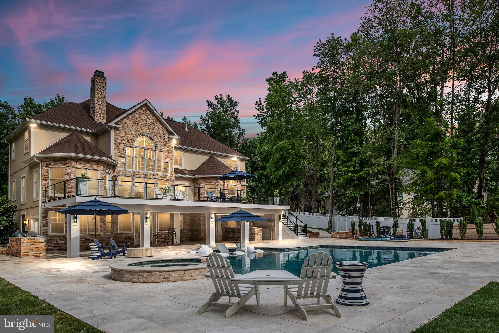 A must see, one-of-a-kind, water-front home that has breathtaking views of both the lake and a resort style backyard to enjoy the astonishing sunrises and sunsets. The home has 5 bedrooms, 5 baths, 2 large living spaces, a huge outdoor saltwater in-ground pool, hot tub, wet bar, grill bar, pickle-ball court, basketball court, first and second-floor access to indoors, on a over 1-acre lot.  This home was recently renovated, every detail was thoughtfully chosen to highlight the lake views and grandeur of the entire property. You will find only the finest in materials throughout the house, no detail was spared. The home offers floor-to-ceiling double glass doors and windows that extend your living and entertaining space and brings the indoors out on both the top and bottom decks. A huge upper deck with glass railings to maximize water views leads you to the large covered marble deck with an extra cozy feel when wanted to stay in shade.  The lower deck is exquisitely designed with a waterfront pool and hot tub that allows you to relax or do laps across the pool. The covered wet bar and grilling areas will allow you to cook and entertain family and friends without stepping inside any time of the year. An attractive large dock with two boat slots and a boat lift allows for tons of water fun activities and a designated large storage room that has extra storage space for all your water toys.  The water depth allows for powerboats to enjoy year-round. The first floor is designed for entertaining and relaxing with an additional indoor wet bar, living/play area, a guest bedroom, a full bath, and 2 additional bedrooms (NTC) are used as exercise rooms now.  The second floor was chosen for the main living space to be able to take advantage of the water-view with high ceilings, substantial crown molding, and decorative trim work to add to the open feel when you enter the home and its amazing view of sunsets for years to come. The indoor kitchen is massive with all stainless steel appliances, quartz countertops, and a large island to gather family and friends with lake-views from every window.  Gorgeous large family room with a magnificent dual gas fireplace, a formal living room, a home office, and a designer half bath. This home even has its own pool room for more fun on the second level. The third level has 4 bedrooms and 3 full baths with a catwalk hallway that has a beautiful view of the lake. The Master bedroom has its own office space, a gas fireplace, his and her closets, and a beautiful ensuite bathroom.  Also, a spacious second bedroom, a bathroom, and third and fourth bedrooms, with a Jack and Jill bath. Escape to another world with this striking waterfront estate resting in the most sought-after community of Fawn Lake.  The community offers a spanning over 7 miles of shoreline, boating, paddle boarding, kayaking, swimming, and fishing. You have easy water access to the country club restaurant, pool, and deep water floats. If you are a golfer, the Arnold Palmer designed 18 hole golf course awaits your tee time. The family friendly Fawn Lake community offers tennis courts, basketball courts, volleyball courts, pickle-ball courts, soccer fields, baseball fields, swimming pool and marina with boat slots for rent. Plus walking trails, club house, fitness center, Lakeside Restaurant, Country Club, and playgrounds.  All the amenities you can imagine are just outside your front door. Come experience what the lake lifestyle is all about! More pictures will be uploaded soon.
