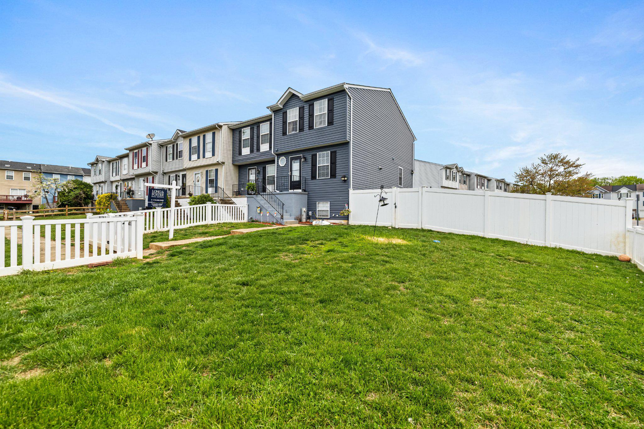 Welcome home to this beautiful end-of-group townhome nestled in the community of Carroll Wood Manor. This home offers three bedrooms, two and a half baths, and a fully finished basement that provides additional living space, a home office ,or even a gym. Step inside to a traditional layout with a combined kitchen and dining area, complete with a cozy, well-appointed kitchen, and access to a rear deck—perfect for outdoor gatherings. Enjoy luxury vinyl plank flooring on the main level, plush carpeting upstairs, as well as upper level laundry for convenience. Step outside to a truly unique, generously fenced-in yard  that offers endless possibilities for outdoor living. This expansive space is perfect for entertaining guests, hosting barbecues, or simply relaxing in your own private retreat. Additional highlights include walk-in closets, a backyard shed for extra storage, a walk in shower, and a beautifully maintained neighborhood. Conveniently located near shopping, dining, and the water! This wont last long!