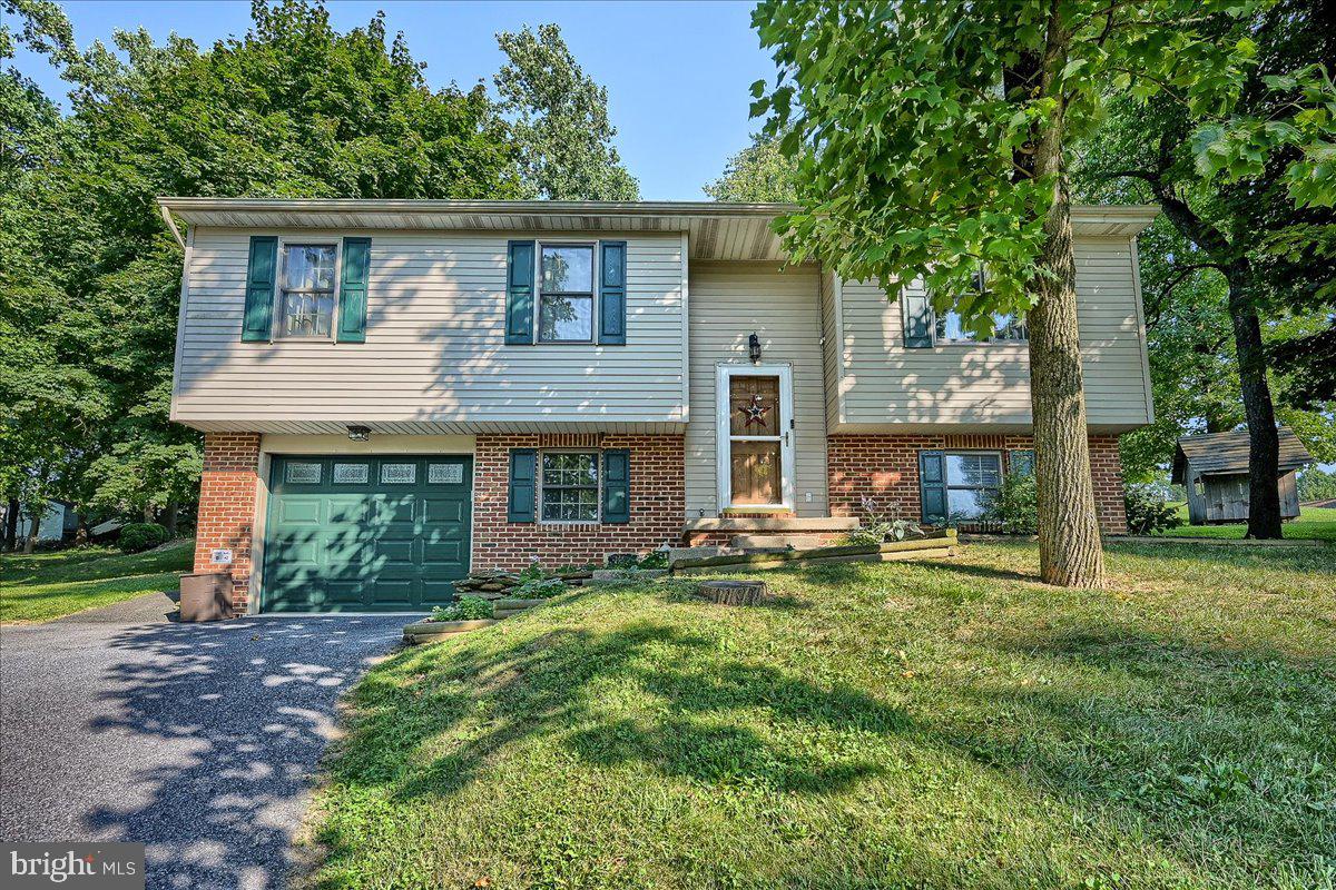 If you're looking for country living, don't miss this 3 bed, 1.5 bath bi-level home with an oversized one car garage.  List of updates include:  new garage door and opener, new dining room and kitchen light fixtures, new kitchen appliances including garbage disposal and rolling kitchen island, new water treatment equipment and UV light, new septic system alarm,  new paint in bath, ceiling fan in office bedroom, new handrails.  This home is located in Martic Township in Penn Manor schools close to many parks and the rail trail with lots of outdoor recreational activities.  Schedule your showing today!
