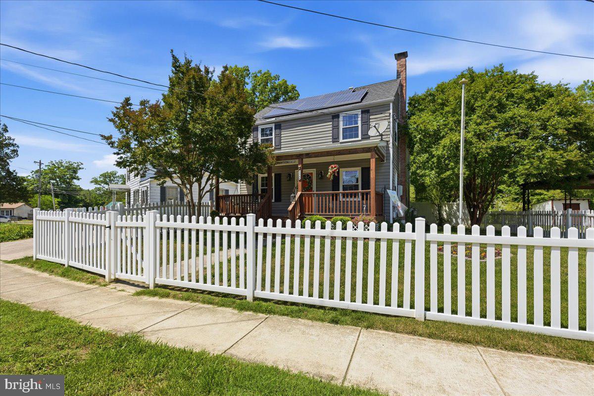 Charming Updated Colonial with Modern Kitchen, Private Owner’s Suite & Solar Savings

Welcome home to this beautifully maintained Colonial offering timeless curb appeal, modern updates, and energy-efficient living in a convenient Lexington Park location. Nestled behind a classic white picket fence, this inviting property combines charm, comfort, and functionality.

Step inside to discover a warm and welcoming floor plan featuring generous living spaces designed for both everyday living and entertaining. The spacious family room is centered around a cozy pellet stove, creating the perfect gathering space on cool evenings. The heart of the home is the large, modern kitchen, offering abundant cabinetry, ample counter space, and room for meal preparation, casual dining, and hosting family and friends.

Upstairs, the private primary suite serves as a relaxing retreat complete with a walk-in closet and en-suite bath. With three full bathrooms throughout the home, there is plenty of space and convenience for family members and guests alike.

Energy-conscious buyers will appreciate the solar panels, helping to reduce utility costs while supporting a more sustainable lifestyle.  Outdoor living is equally impressive with a fully fenced backyard offering privacy and plenty of room for entertaining, gardening, pets, play areas, or future customization. Enjoy morning coffee on the charming front porch.

Conveniently located near shopping, dining, schools, and NAS Patuxent River, this move-in-ready home offers the perfect blend of comfort, efficiency, and small-town charm.
Highlights Include:
• Spacious modern kitchen with abundant workspace and storage
• Primary suite with walk-in closet and en-suite bath
• Three full bathrooms
• Separate Office Space
• Spacious family room with pellet stove
• Charming front porch
• Fully fenced backyard
• Convenient Lexington Park location
This move-in-ready home is ready to welcome its next owners—schedule your private tour today!