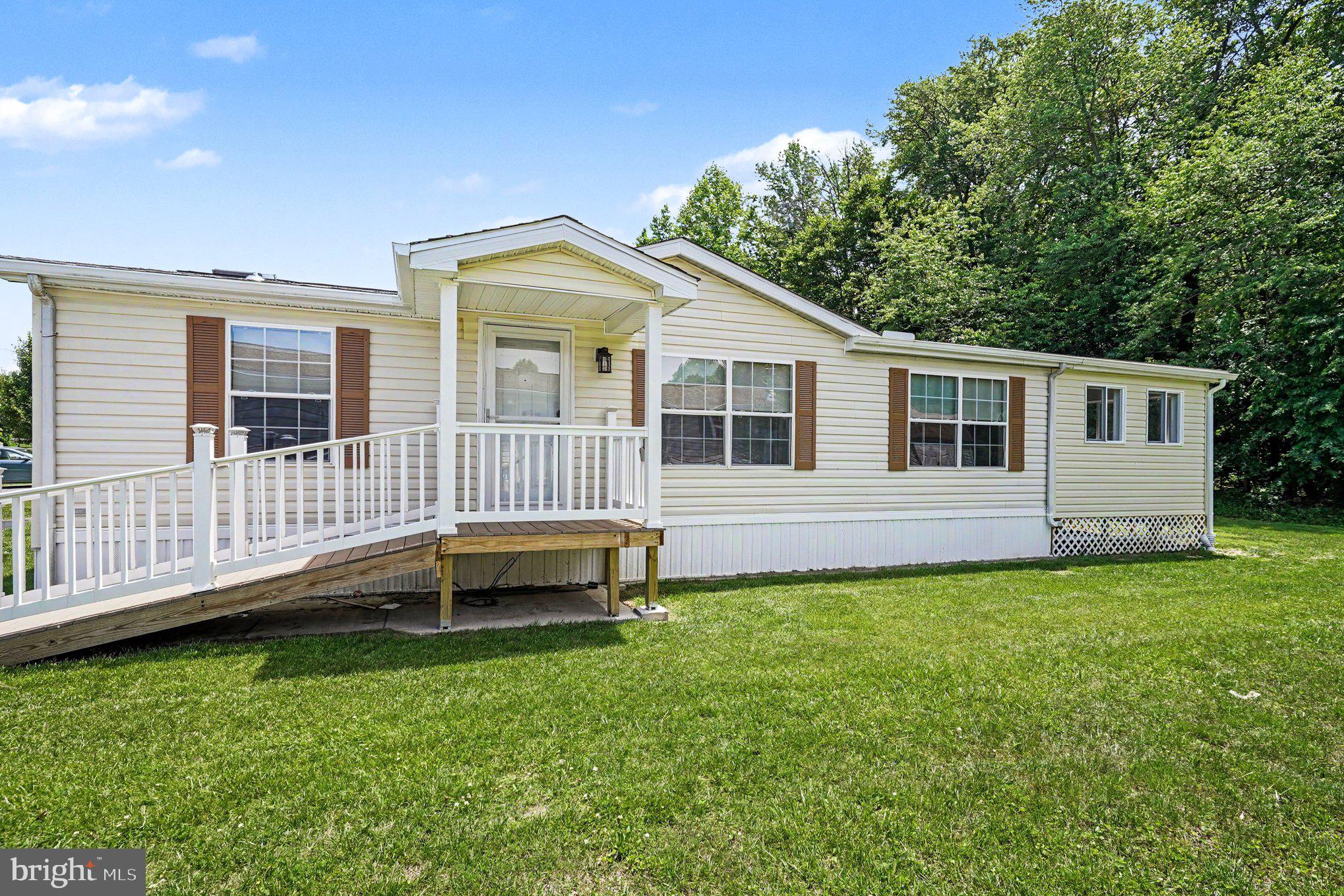 Move-in ready and recently updated! Situated in the sought-after community of Cecil Woods, 3-bedroom, 2 full bath manufactured rancher ("Sassafras" model) offering numerous recent updates and located with close proximity to Rt 40, I-95, Harford County and the shops and restaurants of the quaint and historical town of North East, Maryland. As you enter you will be greeted with vaulted ceilings and beautiful, recently added LVP flooring throughout. Main level highlights include a recently updated kitchen featuring new stainless steel appliances, farmhouse sink, butcherblock countertops, updated lighting, 2 pantry's and a peninsula with seating. Additional details include a living room, dining area, 3 bedrooms, including a primary with an attached remodeled bath and walk-in closet, second remodeled full bath, laundry/utility room and a sprawling, recently added 3-season sunroom. Sunroom details include a vaulted beadboard ceiling,  attractive LVT flooring and loads of windows adding tons of natural light. Additional property upgrades include a new architectural roof and skylights (2025), new water heater, updated 200 amp electric service and new HVAC (heat pump with propane backup). The active community center features a large clubhouse that includes a kitchen, social gathering area, library, billiards, exercise room, party room/game room and walking/jogging paths. Ground rent is $665.00 monthly (no property taxes!) and includes trash pick-up, public sewer and snow removal on the streets. Buyer must receive park approval from Cecil Woods (see documents for application). If you are searching for a move-in ready, affordable home located in a peaceful and friendly community, your search is over... 226 Woods Way... Welcome Home!!!
