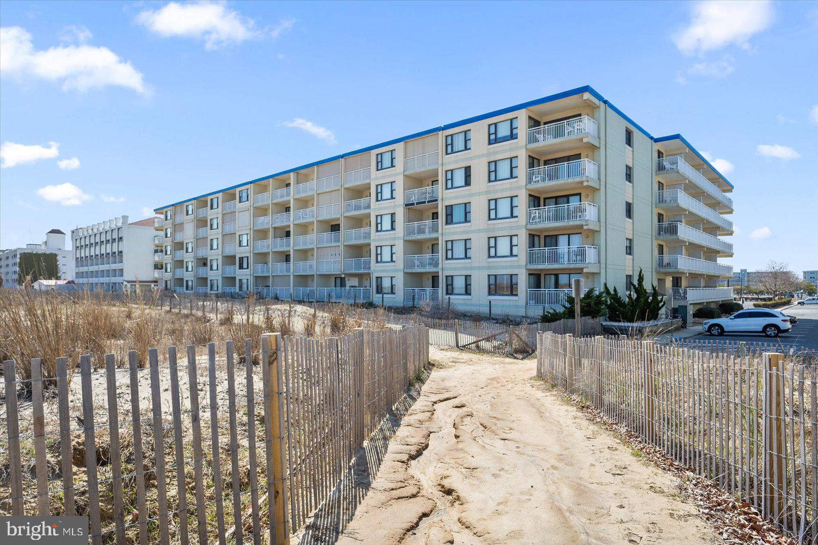 Rare! Top-Level, Oceanfront, Fully Remodeled & Upgraded Home at Popular Diamond Beach!

This stunning property was lovingly designed and professionally remodeled by the owners to be their private oasis and home away from home. Come fall in love with what a 5th-floor unit in a concrete building with two elevators has to offer— a worry-free retreat with breathtaking views of the beach and ocean the moment you step inside. Enjoy the relaxing sounds of the ocean from your private balcony and bedroom.

This home boasts commercial-grade waterproof LVT floors, a white chef’s kitchen featuring gorgeous coastal-themed quartzite countertops and backsplash, stainless steel appliances, and a reverse osmosis water system for water and ice filtration. The spacious pantry and dry bar add both convenience and elegance, while room-darkening window treatments and shutters, ceiling fans/lights in all rooms, and a frameless shower with built-in medicine cabinets and designer tile/floors in the master bath elevate the space.

Additionally, a spacious laundry room is equipped with a brand-new washer and dryer and ample storage for organization. A Carrier Coastal HVAC system and balcony porch storm shutters were installed more recently for added comfort and peace of mind.  Diamond Beach is well-managed, pet-friendly for owners, and offers some of the lowest condo fees in Ocean City.

Two assigned parking spots convey, with ample overflow parking available. The community is ideally located in Midtown, near fantastic dining, family-friendly activities, popular nightlife, shopping, and the convention center!

The home has never been rented by the current owners and pristine.. Being sold beautifully furnished, including fabulous poly porch furniture, three smart TVs, beach games, a surfboard, chairs, a beach umbrella & much more. It truly has everything you could want… just bring your suit and toothbrush and start making memories!  Owner is RE.
