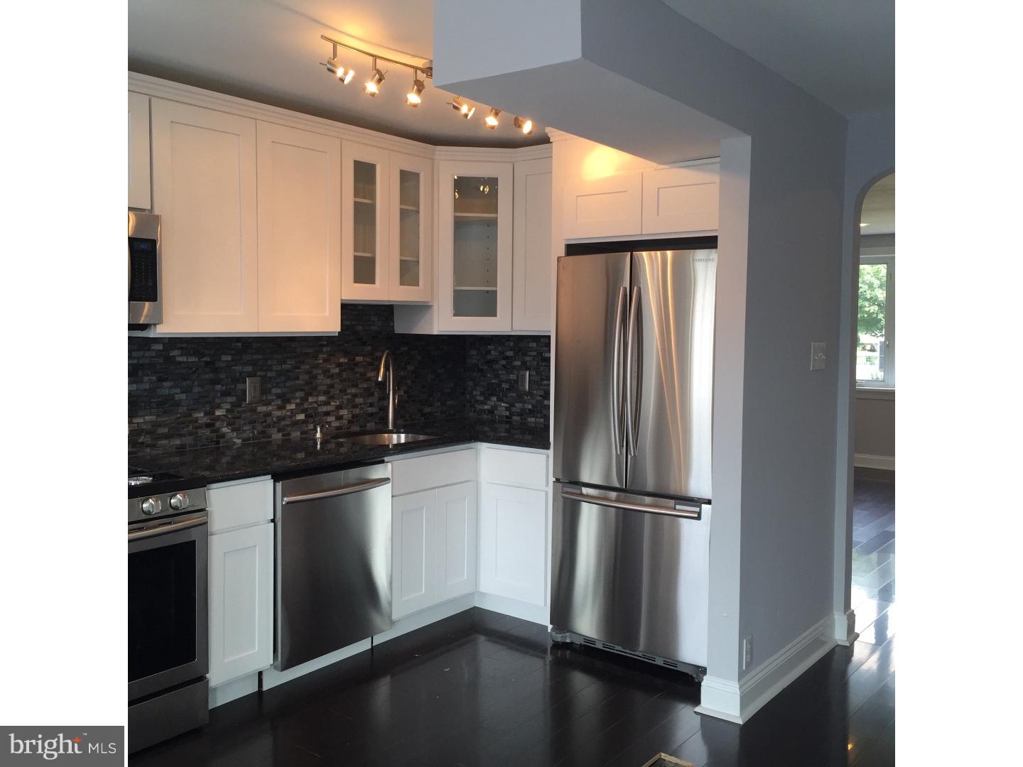 Spectacular renovation like new construction on beautiful tree lined street!  Gleaming hardwood floors throughout the main and upper floors. Custom 36" cabinets, moassic tile backsplash, granite counter top, breakfast bar with granite counter top.  Stainless steel Samsung high end appliances.  Recessed lighting and custom designer lighting throughout the house. Stunning diningroom opens up to large deck overlooking a detached yard.  Upper level has hardwood floors in all 3 bedrooms, and the hall bath has custom tilework with high end vanity and finishes.  The finished basement includes a powder room and walk out to the yard and your private parking. New central air and roof, ready to move in to this beautiful home with so much to offer.  More pictures to follow.