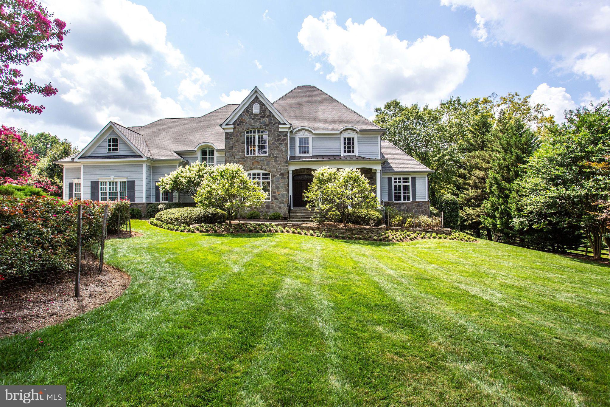 Gracious, stately living awaits on a private, one-acre lot in Vienna/Oakton area.  From the moment you enter this lovely home, you'll appreciate the finishing touches and attention to detail.  Warm Brazilian Cherrywood floors and a curved staircase greet you as you walk through the front door.  Beautiful entertaining space abounds with the formal dining room, formal living room, and amazing music/additional living room (the beautiful architectural detail of the ceiling and Palladian windows are not to be missed).  The back portion of the home including the kitchen and family room can be open to entertaining visitors or closed to provide privacy for family members.  A second staircase and elevator provide private access to the upper and lower levels of the house.    Amenities to make life easier during Covid abound!  Two offices and six bedrooms provide ample space for online work, online school, crafts, a home-based business, etc.  A separate media room offers private TV/movie viewing.  Enjoy the quiet, private space of the one-acre lot located on a cul-de-sac.  Cooking is a joy in the gourmet kitchen complete with a gas Thermador cooktop and Sub-Zero refrigerator/freezer.  A gracious family room with a coffered ceiling, a cozy gas fireplace, and built-ins adjoins the kitchen.  Beautiful, large windows let in an abundance of light throughout this home.  Additional features to make life more comfortable and gracious include a triple-zoned HVAC system, two tankless hot water heaters, kitchenette/wet bar in the basement (perfect for an in-law or au-pair suite), generous master suite with gas fireplace, elevator to all three levels, three-car side-load garage with additional work-space/utility sink, tasteful driveway with paving stones, loads of built-ins, and an elegantly landscaped yard.    Proximity to shopping, restaurants, parks, and transportation is an additional bonus.  Located just off of Hunter Mill Road this location provides easy access to Dulles Airport, I-66, Oakton Shopping Center,  Reston Town Center, Tysons Corner, downtown Vienna, and local parks.  Cycling enthusiasts are just minutes away from the W&OD trail on Hunter Mill Road (there is a parking lot where Hunter Mill and the W&OD cross).   Brand-new paint and carpet round out the amenities of this lovely home--it's definitely not to be missed!