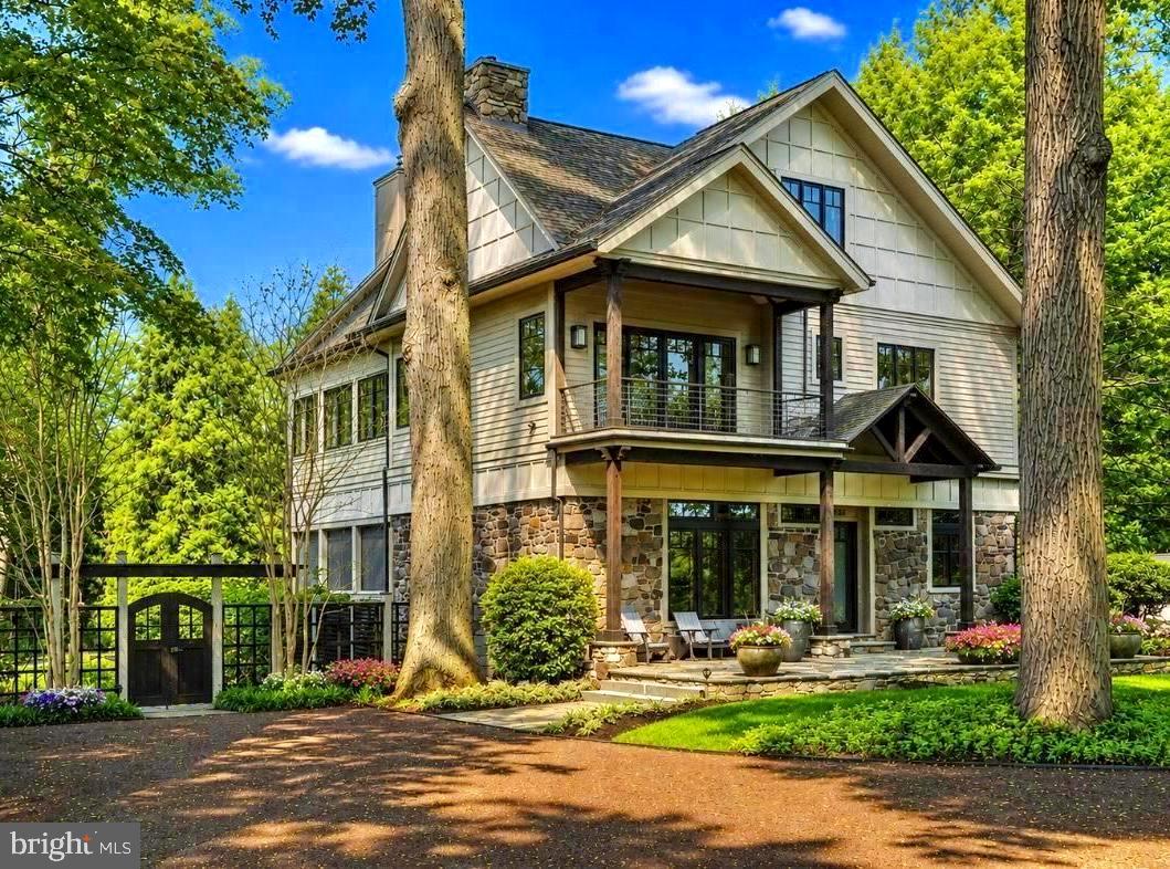 Introducing River Soleil - a magnificent riverfront estate where architectural character, remarkable privacy, and walkable access to downtown New Hope converge into a truly one of a kind offering. Originally a fisherman’s cottage, the property has been transformed into a striking compound that blends warmth, history, and elevated modern design. Framed by towering trees and introduced by a striking timber truss entrance, this extraordinary estate feels worlds away while remaining just moments from the boutiques, acclaimed restaurants, galleries, and charming river towns that define this coveted stretch of Bucks County. Stroll into downtown New Hope, cross the bridge to Lambertville, or explore the nearby destinations of Lumberville, Stockton, and Frenchtown before returning to a private retreat complete with direct river access, a private dock, tiered seating overlooking the shoreline, and immediate access to the scenic canal towpath. A circular driveway and bluestone patio arrival leads into interiors layered with rich materials and custom craftsmanship. Brazilian cherry flooring extends throughout the residence alongside distinctive wood-clad walls, hidden built-ins, curated shelving, and expansive windows framing tranquil landscape and river views. The formal sitting room centers around an oversized stone-adorned wood-burning fireplace, while the contemporary gourmet kitchen balances sculptural design with exceptional functionality. Highlights include matte quartz countertops, a custom glass-topped island with copper detailing, paneled Sub-Zero refrigeration, six-burner Viking range, iridescent backsplash, wine refrigeration, refrigerated drawers, Bosch dishwasher, Franke sink, built-in microwave, and a fully equipped butler’s pantry with additional storage. Accordion doors open the dining area directly into a four-season stone-floor patio overlooking the grounds and riverfront setting beyond. Additional gathering spaces include an expansive family room with oversized windows, surround sound, iron stair railings, and a striking frosted glass window wall that balances light with artistic expression. Upstairs, additional bedrooms feature custom closet systems and beautifully finished baths, including one ensuite. The Owner's Suite occupies its own private wing introduced by a library complete with wet bar,  wood-burning fireplace, and access to an additional four-season room overlooking the gardens. Inside the suite, river views take center stage alongside window seats, dual dressing closets, a spacious bath with soaking tub, extended dual vanity, and walk-in shower. A spiral staircase ascends to a third-level office, fitness space, and flexible bonus area surrounded by elevated river views. The lower level offers extensive storage, a wine storage wall, heated garage space with workshop potential, central vacuum, whole house generator, and three-zone HVAC. Outside, the estate unfolds into an extraordinary private compound with extensive landscaping, irrigation system, fencing, resort-style heated saltwater pool, hot tub, and a fully equipped cabana featuring a bar, refrigeration, sink, television, outdoor shower, and covered lounge seating. Completing the offering is a beautifully designed guest cottage showcasing a fireplace, full kitchen with matte quartz surfaces, live-edge bar seating, covered patio, two spacious bedroom suites, and an additional upper-level retreat with flexible living space. Rarely does a property combine this level of architectural distinction, riverfront access, privacy, and walkability in the heart of Bucks County. Discover the ultimate lifestyle that awaits at River Soleil.