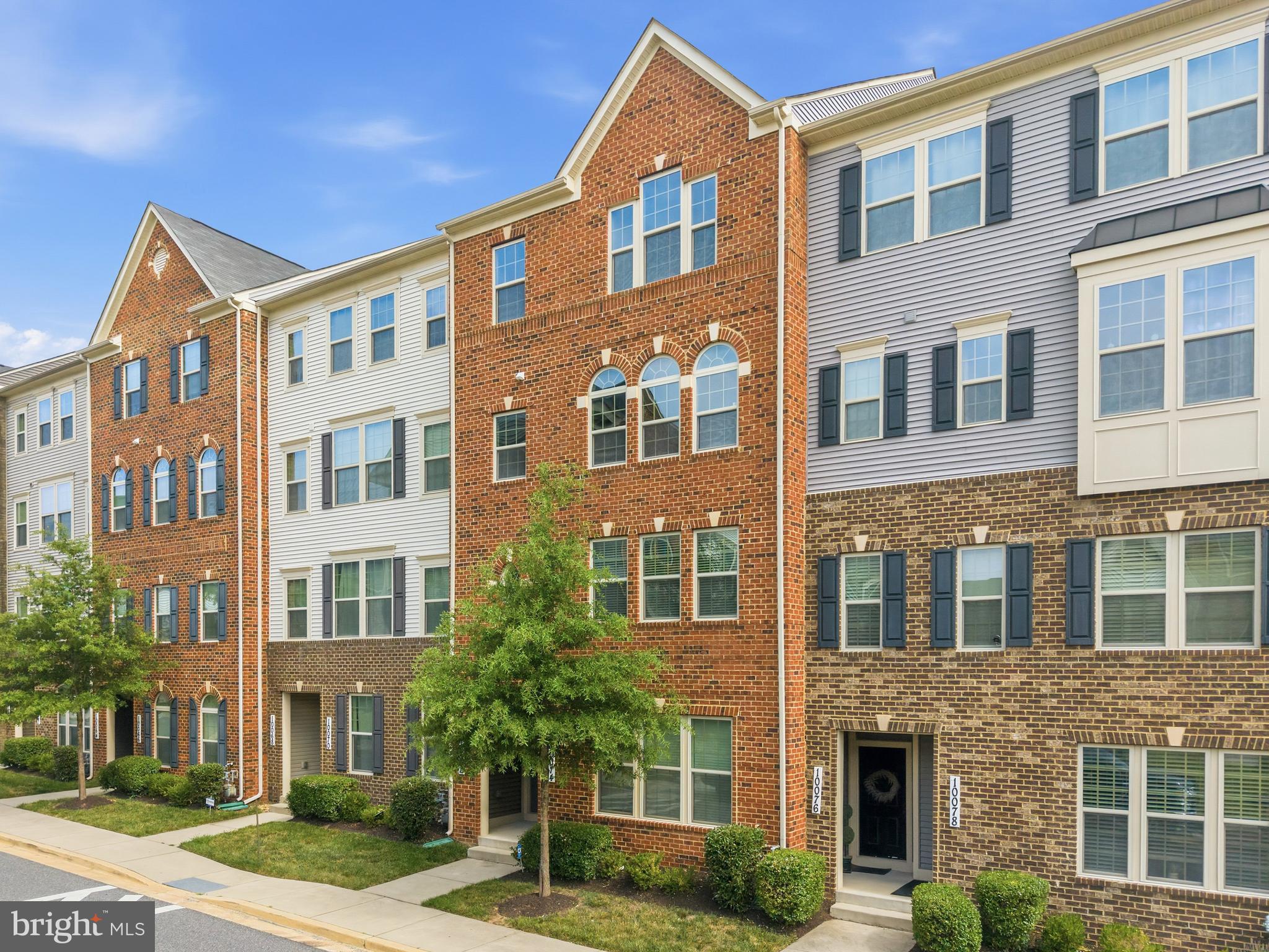Former builder's model home with over 2,660 square feet of beautifully upgraded living space! Built in 2018, this exceptional townhome-style condominium offers the perfect combination of modern design, generous living areas, and an unbeatable commuter-friendly location. The bright, open-concept main level is designed for effortless entertaining and everyday living, featuring luxury vinyl plank flooring, a spacious living room, dedicated dining area, and a stunning kitchen with quartz countertops, stainless steel appliances, abundant cabinetry, and expansive prep space. A convenient powder room and private balcony complete this inviting level. The upper level is highlighted by an impressive primary suite with two walk-in closets and a private en-suite bath. Two additional generously sized bedrooms, a full hallway bathroom, and an upper-level laundry area provide comfort and functionality for today's lifestyle. Additional highlights include a one-car garage, private driveway, and the premium finishes expected of a former model home. Ideally situated in Lanham, you'll enjoy convenient access to shopping, dining, and entertainment at Woodmore Towne Centre, as well as nearby bus routes, the New Carrollton Metro Station (Orange Line), MARC train service, and major commuter routes including Route 50, I-495, and MD-295. NASA Goddard Space Flight Center is also just minutes away, making this an outstanding location for commuters and professionals alike.