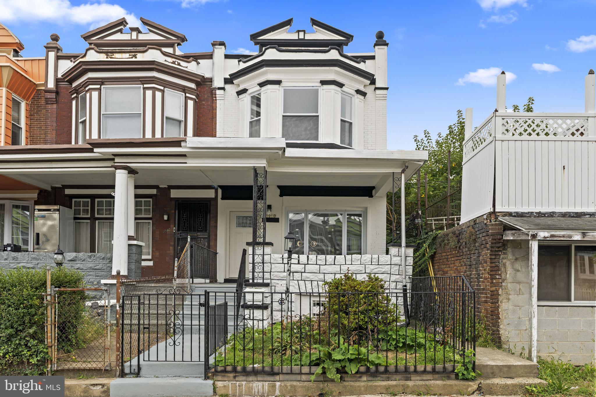 Welcome to 1010 S 51st Street—a beautifully renovated 4-bedroom, 3-bathroom home offering over 1,500 square feet of thoughtfully designed living space on a quiet, tree-lined street in the heart of Kingsessing. Every detail has been carefully updated to blend modern style with everyday functionality, creating a move-in-ready home that's sure to impress. Step inside to an open and inviting floor plan featuring luxury flooring, recessed lighting, and an abundance of natural light throughout. The spacious living and dining areas flow seamlessly into the stunning designer kitchen, complete with white shaker cabinetry, quartz countertops, stainless steel appliances, stylish tile backsplash, ample cabinet space and a large island—perfect for entertaining or everyday living. The second level offers three generously sized bedrooms, including a spacious primary suite with a beautiful private bathroom. An additional full bathroom showcases modern vanities, designer tile work, and sleek contemporary finishes. The finished lower level provides valuable additional living space with another bedroom and full bathroom for added convenience.  The common area can serve as a family room, home office, gym, or guest suite. Additional highlights include all-new mechanical systems, updated plumbing and electrical, central air conditioning, new windows, and modern fixtures throughout, providing a peace of mind for years to come. Conveniently located just minutes from University City, Center City, major highways, public transportation, parks, shopping, and dining, this exceptional home offers the perfect combination of style, space, and location. Don't miss your opportunity to own this gem—schedule your private showing today!