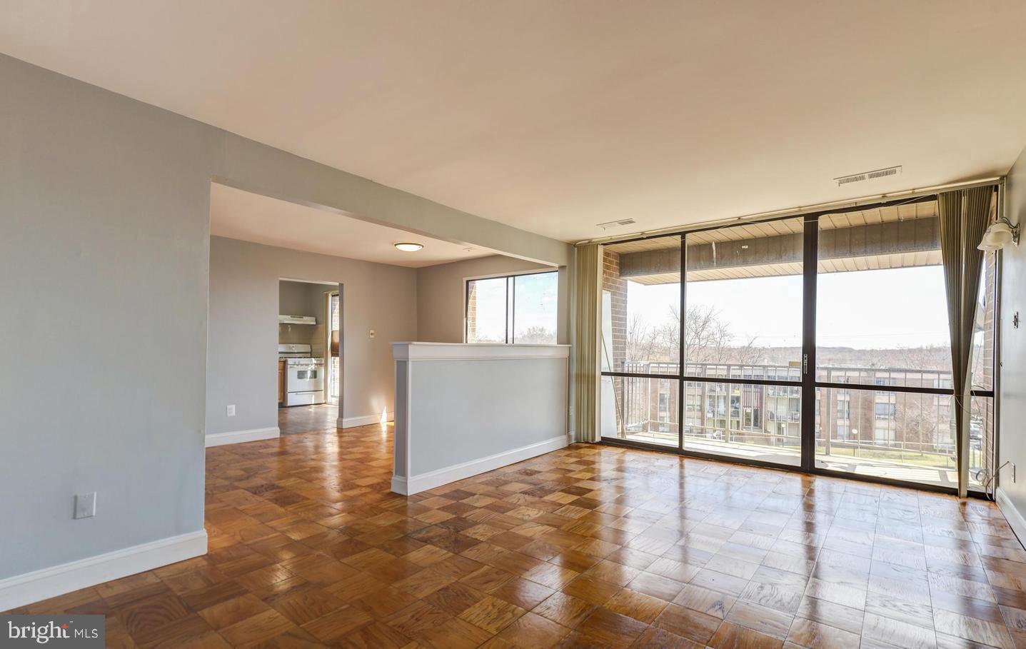 Discover the perfect blend of charm and convenience in this well maintained two-bedroom + den, two-bathroom condo, nestled in the highly sought after Bedford Towne Condo community. Flooded with natural light, this inviting home features timeless hardwood flooring throughout and a spacious living room with sliding glass doors leading to a covered patio. The dining room offers ample space, while the kitchen boasts brown cabinetry, white appliances, and a gas range. Down the hall, the primary suite provides a private bath and walk-in closet, while the additional bright and versatile bedroom and den enjoy easy access to a full hall bath. Ideally situated in the Adelphi/Langley Park area, this home is centrally located between College Park and Silver Spring. Commuters will appreciate easy access to I-495, Metro, and Washington, D.C. Plus, enjoy shopping, dining, parks, and recreational options in every direction. Don’t miss this incredible opportunity to own this home!