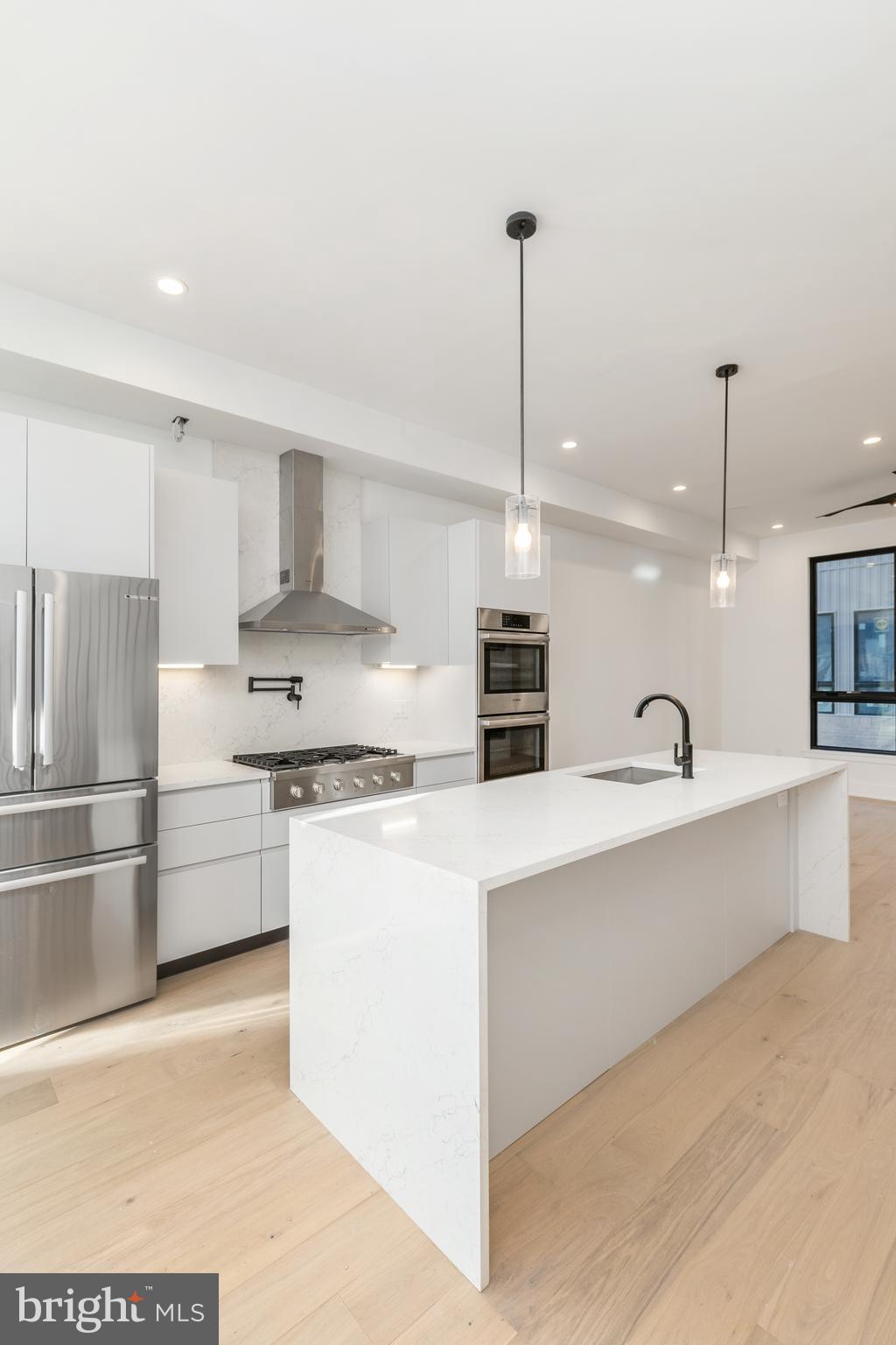 Extra large, 20-foot-wide new home at Artist Village, Philadelphia's brand new community of spectacular stately residences. With its prominent location at 17th & Bainbridge Streets in the heart of the historic Graduate Hospital, this unique enclave of homes will transform an entire city, bringing new life to a treasured neighborhood. Developed by The Regis Group & Ingerman Company, the first phase of Artist Village offers twelve luxury townhomes running parallel down 17th St and Colorado St. Each residence has been expertly designed, by JKRP Architects, with a layout that perfectly blends form with function. Every home will have private 1-2 car garage parking, an expansive roof deck - three outdoor spaces total, a tax abatement, elevators in the 17th Street homes and smart-home technology throughout plus the homes on 17th Street each have an elevator! A handsome brick facade greets you at the home's exterior. Once inside, you'll discover a completely open main level with a living room and dining area filled with natural light from tall windows. The stunning chef's kitchen, adorned with top-of-the-line appliances, custom cabinetry, and designer finishes, is sure to become the heart of the home! The lower level has the all-important 1-2 car garage parking and a bonus space ideal for a home theater, playroom, or gym. The second level has two bright bedrooms, two full bathrooms, and a conveniently located laundry closet. The primary suit covers the entire third level, acting as a private retreat. There's a large bedroom with great natural light, a custom walk-in closet with space to share, and a luxurious bathroom fitted with a double vanity, soaking tub, rainfall shower, and a water closet. Topping off this amazing home is a one-of-a-kind bi-level roof deck! With a powder room and wet bar equipped pilot house, tons of space to spread out, and mesmerizing views of the city, this is an entertainer's paradise! Not only is Artist Village a fantastic development, but it's also in an equally fantastic neighborhood. This highly sought-after Graduate Hospital location earns a WalkScore of 97! Nearby, South Street is lined with local restaurants, shops, and markets. Fine dining, luxury shopping, and lively entertainment can be found in neighboring Rittenhouse Sq, plus Target, Sprouts Farmers Market, and Wine & Spirits are less than a 10-minute walk. This central location also provides easy access to Broad St, Washington Ave, Jefferson Hospital, Pennsylvania Hospital, University City, and I-76. Artist Village presents a rare opportunity not to be missed. The time is now to reserve your home, customize your finishes, and plant your roots in Graduate Hospital's next chapter. The top floor flex space can easily be converted into a fourth bedroom; a door can be added for privacy. Taxes and square footage are the responsibility of the buyer to have verified. Association fees are TBD. Photos/renderings are for marketing purposes only and may not portray actual finishes.