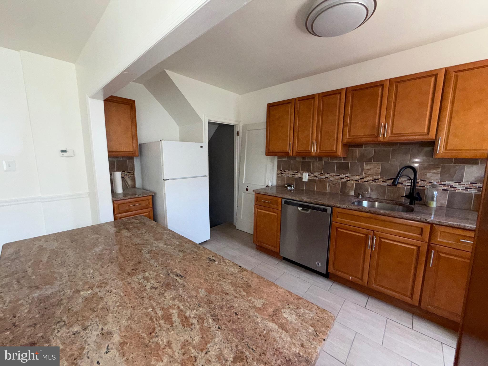 Welcome home to this beautifully maintained and move-in-ready property featuring 4 bedrooms and 2 full bathrooms. The upstairs offers 3 spacious bedrooms and a fully renovated bathroom, while the finished lower level provides an additional bedroom, full bathroom, and flexible living space perfect for guests, extended family, a home office, or recreation area. The heart of the home is the modern, updated kitchen, thoughtfully designed with contemporary finishes and ample cabinetry, making meal preparation and entertaining a pleasure. Step outside and enjoy the raised front patio, an ideal space for outdoor entertaining, summer barbecues, morning coffee, or relaxing evenings with family and friends. A private driveway provides convenient off-street parking for one vehicle. This turn-key home combines comfort, style, and functionality, offering everything you need to move right in and start making memories. Don't miss this wonderful opportunity to own a beautifully updated home ready for its next owner!