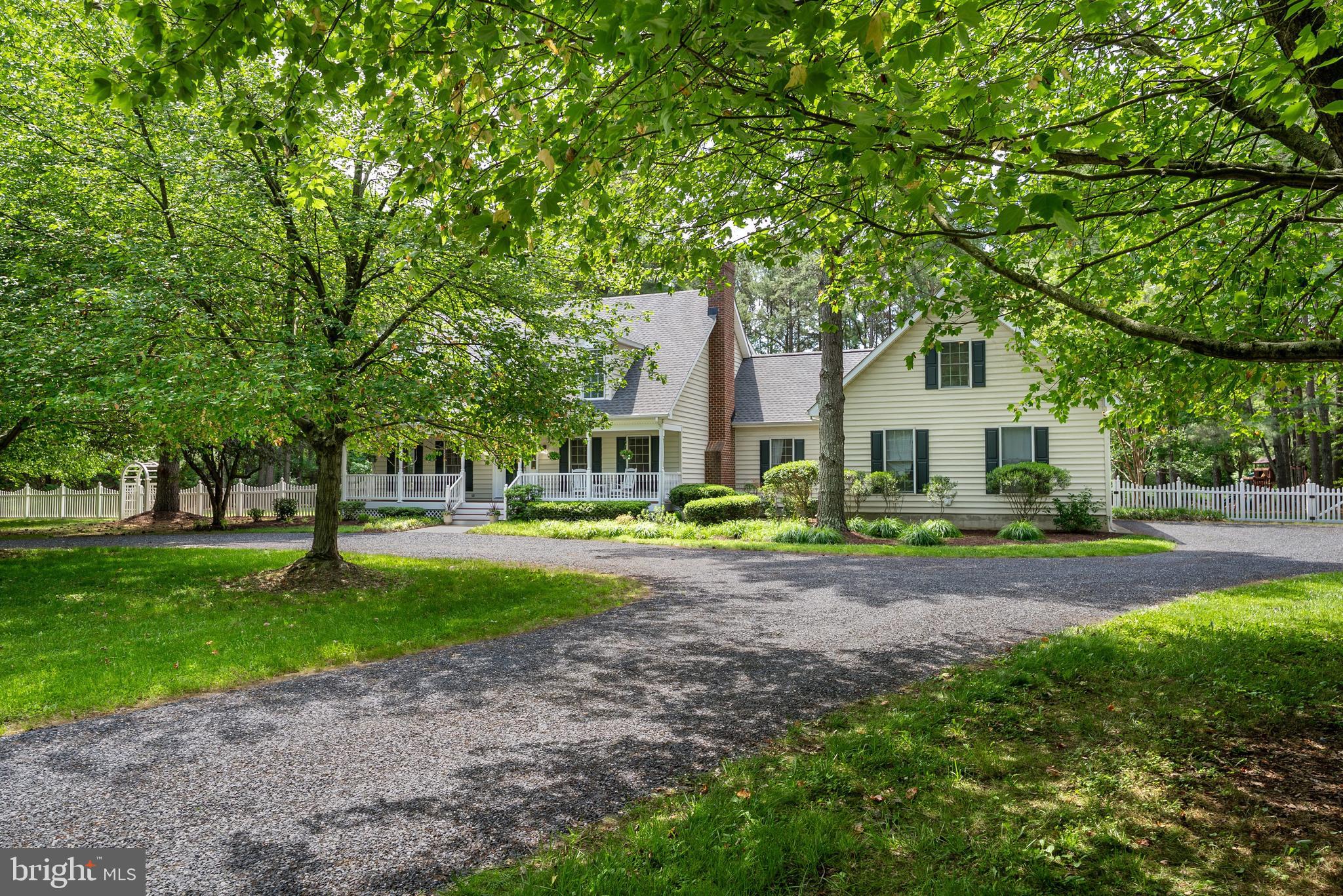 Set on 2.8± private acres along the highly sought-after Oxford Corridor, this spacious residence offers the perfect blend of comfort, space, and timeless Eastern Shore appeal. A welcoming rocking-chair front porch, huge fenced rear yard with expansive rear deck perfect for entertaining with a custom  retractable awning, , paver patio, and in-ground saltwater  pool create an ideal setting for relaxed luxury living and effortless entertaining.

Inside, the spacious floor plan is thoughtfully designed for both comfortable everyday living and effortless entertaining. The inviting family room features custom built-ins and a fireplace, seamlessly flowing into the gourmet kitchen appointed with custom cabinetry, Caesarstone countertops, center island, oversized walk-in pantry, and Viking  gas cooktop. A formal living  provides additional gathering area. 

The first-floor owner’s suite offers a custom ceiling detail, private remodeled  bath, walk-in closet, and direct access to the rear deck, creating a peaceful retreat. Upstairs, three generously sized en-suite bedrooms provide comfort and privacy for family and guests alike, including a spacious bonus room ideally suited as a private guest area  or flex space over garage. 

Completing the property is an attached 3-car garage and beautifully landscaped grounds, ideally located just moments from  the shops, dining, and amenities of  Historic Easton and close to  the waterfront charm of Oxford .
Wood floors in all rooms except  primary bedroom. Gas fireplace never used going "as is".   BAT septic system serviced 5/26/26. Irrigation never used, going "as is" Electric dog fence does not work.  Crawlspace and attic have been conditioned . New roof recently added.