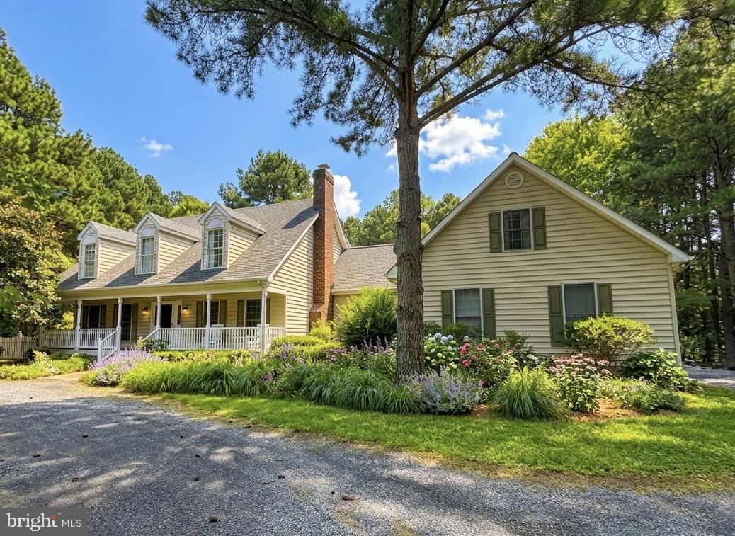 Set on 2.8± private acres along the highly sought-after Oxford Corridor, this spacious residence offers the perfect blend of comfort, space, and timeless Eastern Shore appeal. A welcoming rocking-chair front porch, huge fenced rear yard with expansive rear deck perfect for entertaining with a custom  retractable awning, , paver patio, and in-ground saltwater  pool create an ideal setting for relaxed luxury living and effortless entertaining.

Inside, the spacious floor plan is thoughtfully designed for both comfortable everyday living and effortless entertaining. The inviting family room features custom built-ins and a fireplace, seamlessly flowing into the gourmet kitchen appointed with custom cabinetry, Caesarstone countertops, center island, oversized walk-in pantry, and Viking  gas cooktop. A formal living  provides additional gathering area. 

The first-floor owner’s suite offers a custom ceiling detail, private remodeled  bath, walk-in closet, and direct access to the rear deck, creating a peaceful retreat. Upstairs, three generously sized en-suite bedrooms provide comfort and privacy for family and guests alike, including a spacious bonus room ideally suited as a private guest area  or flex space over garage. 

Completing the property is an attached 3-car garage and beautifully landscaped grounds, ideally located just moments from  the shops, dining, and amenities of  Historic Easton and close to  the waterfront charm of Oxford .
Wood floors in all rooms except  primary bedroom. Gas fireplace never used going "as is".   BAT septic system serviced 5/26/26. Irrigation never used, going "as is" Electric dog fence does not work.  Crawlspace and attic have been conditioned . New roof recently added.