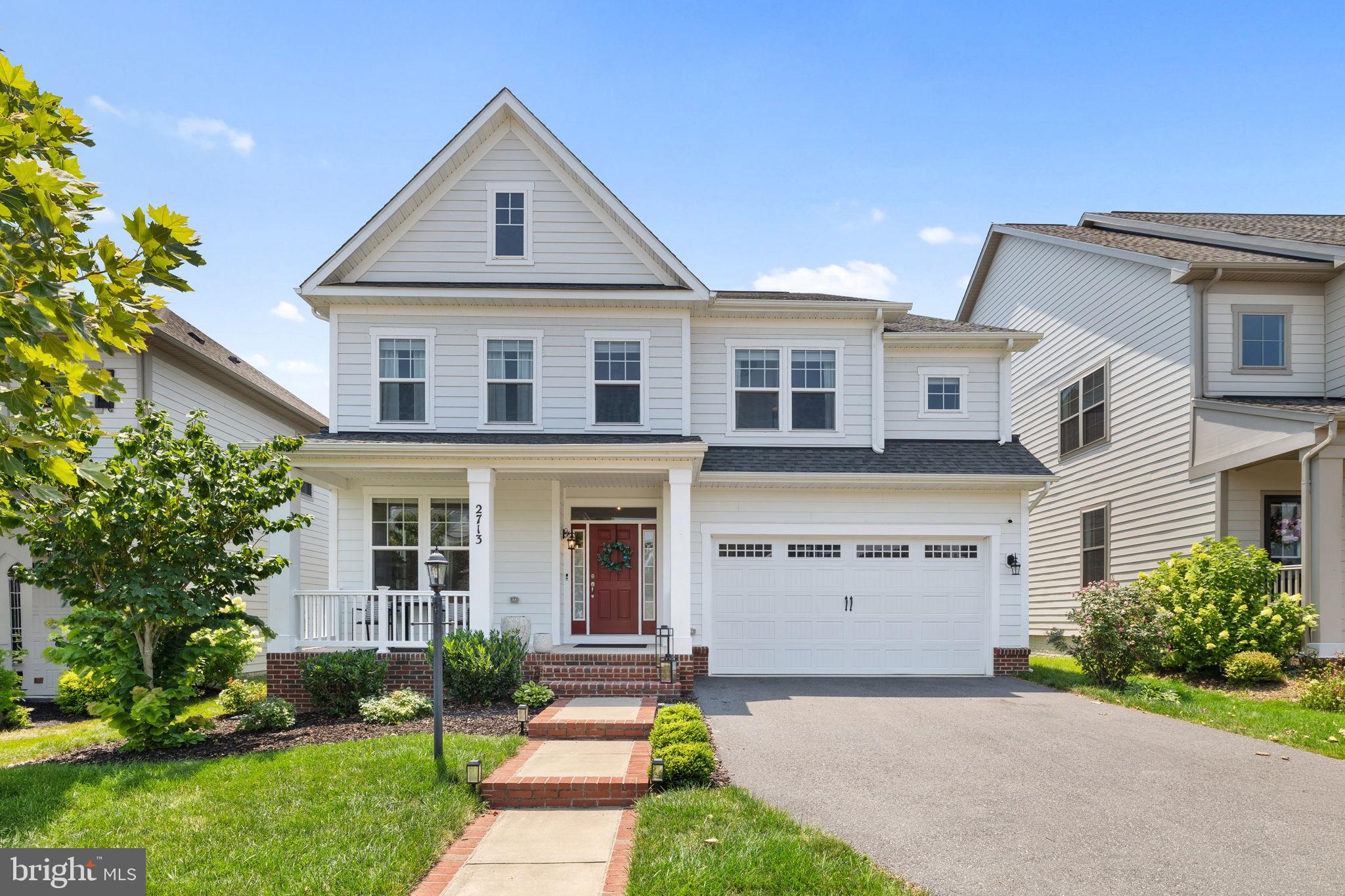 Welcome to 2713 Cockspur Lane, a beautifully appointed home in the highly sought-after Potomac Shores community, where luxury finishes, thoughtfully designed living spaces, and world-class amenities come together to create an exceptional lifestyle.
The inviting main level features a versatile formal living room that can easily serve as a home office, library, or flex space, along with a spacious dining area perfect for hosting family dinners or holiday gatherings. The open-concept floor plan seamlessly connects the expansive family room to the gourmet kitchen, creating an ideal setting for both everyday living and entertaining.
Designed with both style and function in mind, the kitchen showcases an oversized quartz center island, Sinclair Birch White cabinetry, a taupe brick-lay tile backsplash, and a premium suite of KitchenAid stainless steel appliances. A convenient butler's pantry provides additional storage and serving space, making entertaining effortless. Wood flooring extends throughout the main level, complemented by elegant oak staircases with contemporary railings and a custom shiplap accent wall that adds warmth and character. Plantation shutters in the family room provide added privacy. Just off the kitchen, step outside onto the newly installed Trex deck, offering the perfect space for outdoor dining, grilling, or relaxing while overlooking the fully fenced backyard.
The upper level is thoughtfully designed to provide comfort and convenience. The spacious owner's suite offers an impressive 20' x 18' layout, creating a true private retreat. Dual walk-in closets provide abundant storage, while the luxurious en-suite bathroom features a frameless glass shower with white subway tile extending to the ceiling, elegant tile flooring, and white cultured marble countertops. Three generously sized secondary bedrooms share a well-appointed full hallway bathroom. The upper-level laundry room includes newer washer (2025) and dryer (2026). 
The partially finished lower level expands the home's living space with a spacious recreation room ideal for a media room, game room, fitness area, or additional entertaining space. New luxury vinyl plank flooring provides a modern and durable finish, while the unfinished storage area offers exceptional storage capacity and includes a rough-in for a future third full bathroom, allowing the next owner the opportunity to customize the space to fit their needs.
Living in Potomac Shores means enjoying one of Northern Virginia's premier master-planned communities. Residents have access to an incredible collection of resort-style amenities, including the Jack Nicklaus Signature Golf Course, the Ali Krieger Sports Complex, The Shores Club featuring a state-of-the-art fitness center, movement studio, yoga lawn, an eight-lane competition pool, family pool with sundeck and cabanas, the Canoe Club, miles of scenic walking and biking trails, parks and playgrounds, a community garden, working greenhouse, and a vibrant calendar of community events. Ideally located just minutes from I-95, Route 1, Quantico, and the highly anticipated Potomac Shores VRE Station, this exceptional home offers the perfect combination of luxury, convenience, and an unmatched community lifestyle. Don't miss the opportunity to make this outstanding home your own!
