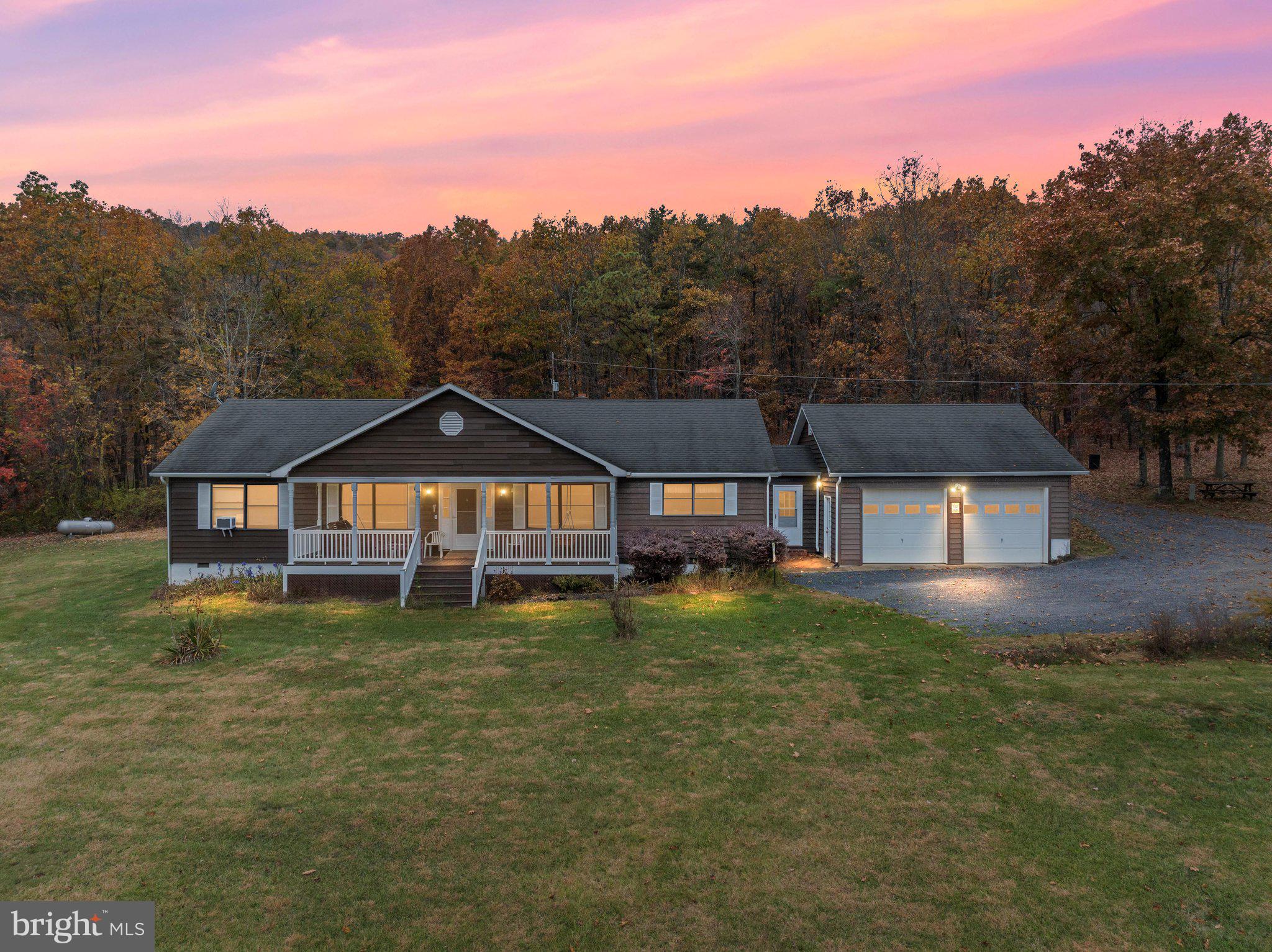 Escape to the serenity of Star Tannery with this inviting ranch-style home on acreage offering over 2,000 sq ft of comfortable living space, beautiful mountain views, and direct access to endless outdoor recreation. This 3-bedroom, 2-bath property includes a welcoming kitchen, separate dining room, living room, family room, and an attached 2-car garage. The A/C was recently replaced for added peace of mind.
Situated on a stunning blend of cleared and wooded acreage, the land is truly the highlight. Enjoy a spring-fed pond, year-round views, and frontage on the expansive George Washington National Forest-your personal playground for hiking, camping, hunting, and exploring. Wildlife is abundant, with regular sightings of deer, turkey, and small game.
With NO RESTRICTIONS, NO CONVENANTS, AND NO HOA, you have complete freedom to make this property your own. Access is simple with road frontage on Capon Springs Grade plus a 50 ft deeded right-of-way. The home is equipped with a conventional septic system and a propane generator.
Perfect as a full-time residence, weekend retreat, or investment opportunity, this property offers the ideal blend of privacy and convenience-just a short drive to West Virginia amenities and the renowned Capon Springs Resort. Inside pictures will be coming soon.