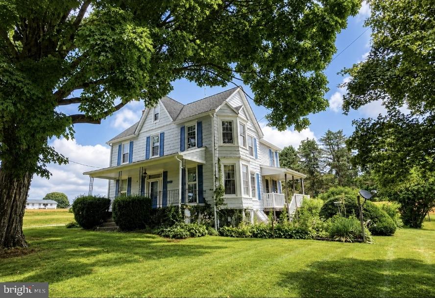Spacious historical colonial in Southern York County Schools with so much potential. This 4 bedroom 1.5 bath has over 2050 square feet and is situated on a .61 acre lot less than 1 minute from I83 and the MD/PA Line. The home features a new architectural shingle roof in 2025, new hvac 2018, replaced windows, new hot water heater in 2022. The home has 2 spacious family rooms, a separate dining room, kitchen, mud room, and a half bath. the 2nd level has 3 possibly 4 bedrooms and a full bath. The 3rd floor has 2 rooms that could be bedrooms or converted into a primary suite. The property has an in-ground pool that had a new liner put in 8 years ago however it has not been reopened in the last 6 years. The home is surrounded by farm land and is conveniently located near all that Shrewsbury and New Freedom have to offer including dining, shopping, the rail trail, and so much more.