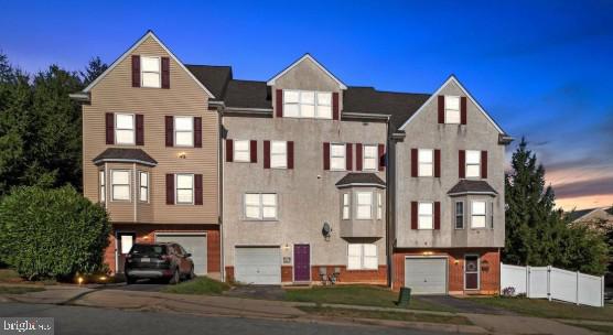 Welcome home to this spacious, move-in ready 3–4 bedroom townhouse located in Conshohocken’s thriving East End. With over 2300 square feet of finished living space, it is significantly larger than the homes on either side, combining generous space, flexibility, and an unbeatable location. Perfectly situated near some of Conshy’s most popular destinations, you’ll enjoy easy access to Coyote Crossing, Trattoria Totaro, Bar Lucca, Conshohocken Brewing Company, Merenda Box, Bar Sera, Fayette Street’s vibrant restaurant scene, the SEPTA Manayunk/Norristown Line, the Schuylkill River Trail, and the Spring Mill Trailhead. Step inside to find a versatile first-floor bedroom, ideal for guests, a home office, or flex space, complete with walk-out access to the backyard and entry to the attached garage. The second floor serves as the heart of the home, featuring a spacious, well-maintained kitchen, dining area, and a family room centered around a beautiful fireplace — perfect for both everyday living and entertaining. A conveniently located powder room completes the level. Upstairs on the third floor, you’ll find two generously sized bedrooms, including a spacious primary suite with an en-suite bathroom featuring a soaking tub and separate standing shower. An additional full bathroom and a conveniently located laundry room add to the home’s thoughtful layout. The finished fourth-floor loft offers exceptional flexibility and can easily serve as a fourth bedroom, media room, playroom, home gym, or additional living space to fit your needs. Additional highlights include brand-new siding on back of the home, a newer roof (2018), no HOA fees, and an ideal combination of space, comfort, and convenience in one of Conshohocken’s most desirable locations.