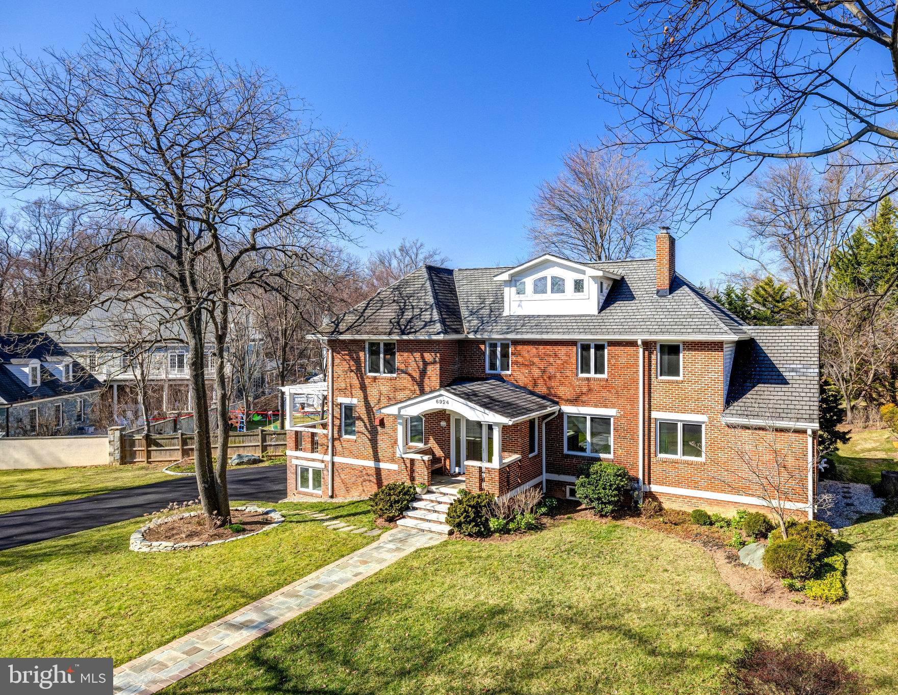 This architecturally detailed all brick, four-level home on Chelsea Rd is a rare gem and has been meticulously enhanced through multiple renovations and additions. The residence offers an oversized two-car garage, a large side and back yard, two covered porches, and a spacious deck for outdoor entertaining. Inside, an ample amount of space for flexible living, and it boasts a total of five bedrooms and four and a half baths. 
The two chef's kitchens are equipped with top-of-the-line stainless steel appliances, catering to culinary enthusiasts and ensuring a luxurious cooking experience. The Dolby surround sound speaker systems provide an immersive audio experience throughout the house. Large casement windows and oak hardwood floors adorn the home, welcoming abundant natural light and creating a bright, inviting atmosphere. 
Architectural subtleties are evident in the design, with features such as arched doorways, granite silestone countertops, cathedral ceilings, and an abundance of thoughtfully designed storage spaces. The hybrid floor plan seamlessly combines modern elements with the home's original charm, creating a harmonious living space.
One of the standout features of this property is its prime location in the heart of McLean, with shopping, restaurants, a library, a community center, and McLean Central Park. The residence is conveniently situated to Washington DC, Tysons, Langley Pyramid Schools, and both Reagan National and Dulles International Airports, offering unparalleled accessibility.