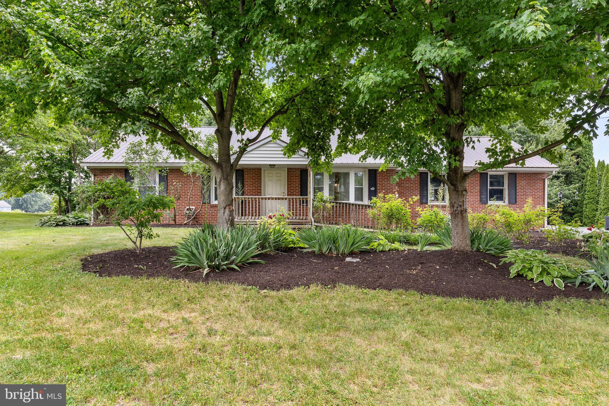 THIS PROPERTY IS GOING TO AUCTION ON TUESDAY JULY 21, 2026 AT 6:00 PM. THE LIST PRICE ONLY REFLECTS THE SUGGESTED STARTING BID. Brick rancher on a .44 acre lot with very nice views from the rear deck and pavilion. First floor offers a living room/dining room combo with hardwood floors and bay window; eat-in kitchen; 3 bedrooms, each with closets; full bathroom with shower. Full basement with finished family room with brick heath for coal or wood stove; office room; storage room; laundry hook-up; Bilco doors to outside; large cold cellar. 22' X 23' attached 2-car garage; updated vinyl windows (2018), updated roof (2018), updated oil furnace and central A/C (2016), new electric water heater (2023), on-site septic and well with filter system. Good solid house, but does need updates and cosmetic repairs.