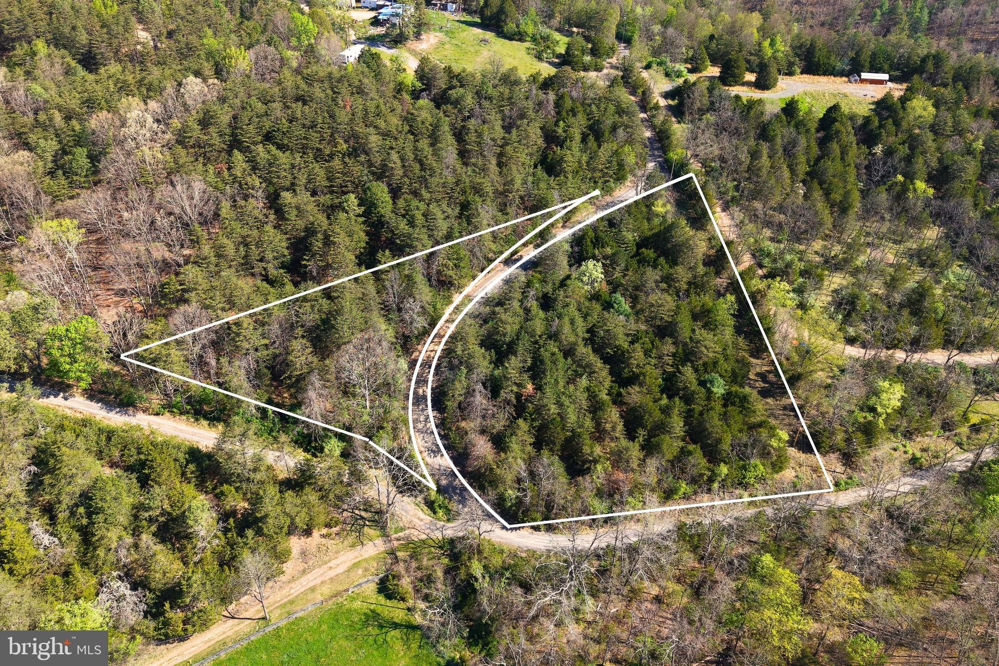 Seller Financing Available – Your peaceful getaway is closer than you think with easy financing.
Deep Run Hollow Road | Delray, WV | 2.65 Acres
An electric meter is already on-site and ready to go — a rare head start on this 2.65-acre wooded retreat in the quiet hills of Delray, West Virginia. A canopied gravel drive stretches approximately 1,167 feet along the road frontage, with a small stream winding along both sides and a natural build site near the road that works well with the existing terrain.
The property is entirely outside mapped flood zones with zero wetland coverage, and neighboring homes with established utilities nearby, with well and septic assumed. Whether you're envisioning a private residence, homestead, or recreational escape, this land is ready for it.
The forest is rich with mature conifers, abundant deer sign, and frequent wildlife sightings including rabbit and squirrel. The dense canopy, flowing stream, and natural cover create ideal habitat for game, offering you a private slice of West Virginia wilderness right on your own land.
All of this in a peaceful rural setting with no commercial nuisances nearby. Washington, DC is 2 hours east and Shenandoah National Park just 1 hour south.
Contact us today to set up a showing. Let's build your vision together!