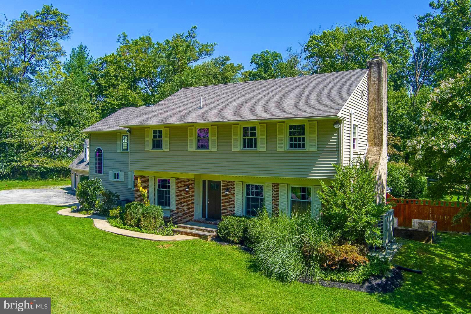 Welcome to 29 Long Lane, Malvern, PA—a stunning 5-bedroom, 3 full bath, 2 half bath home in the highly sought-after Willistown Acres neighborhood, within the top-rated Great Valley School District. Situated on  2 acres of lush, level land, this property offers the perfect blend of privacy and convenience, just minutes from the charming Malvern Borough and the R5 train station.
As you approach the home, you’ll be captivated by its expansive, fully fenced backyard, perfect for children, pets, or entertaining. The centerpiece is a sparkling in-ground pool with a brand-new liner, providing a private oasis for relaxation and summer fun. The detached 3-car garage, with a walk-up unfinished second level, offers ample storage or the potential for a studio or workshop, and is connected to the home by a charming covered breezeway.

Inside, the home is filled with natural light and thoughtful details. Enter through the front door into a formal living room to your left, where a cozy brick fireplace invites you to unwind. To the right, the elegant dining room with chair rail molding is perfect for hosting family dinners or holiday gatherings. The heart of the home is the well-appointed kitchen, featuring a breakfast area, work station, pantry, and an L-shaped island with a prep sink. Sliding glass doors from the breakfast area lead to one of two spacious back decks, creating an effortless flow for indoor-outdoor living.
The newly added great room is a showstopper, with its vaulted beamed ceiling, floor-to-ceiling stone hearth gas fireplace, with built-in bench seating on either side. This stunning space is flanked by sliding glass doors that open to two separate decks, ideal for entertaining or simply enjoying the serene surroundings. The main level also includes a convenient mudroom, coat closet, and powder room off the side entrance.
Upstairs, the first level offers two  bedrooms and a hall bath. Ascend to the second level to discover the third bedroom, another hall bath, a dedicated laundry room, and the luxurious primary suite. This private retreat features an en suite bath with a Jacuzzi tub, two walk-in closets, and a Juliet balcony overlooking the backyard. The suite also includes a opens to versatile bonus space, perfect for a home office, gym, or nursery, with direct access to a back staircase leading down to the mudroom. Finally, the third level of the home offers the space for a fifth bedroom, playroom, or whatever else your dream home may need.
The lower level adds even more living space, with a cozy den that could serve as a media room, playroom, or guest quarters, complete with an attached half bath. A utility room with additional laundry hookups and exterior access adds convenience.
Recent updates, including new carpet, luxury vinyl plank flooring, the great room addition, and a new roof, ensure this home is move-in ready. With 4 zones of heating, you’ll enjoy year-round comfort tailored to your needs.
This exceptional property offers a rare combination of space, style, and location, making it the perfect place to call home. Don’t miss your chance to own this dream home—schedule your private tour today!