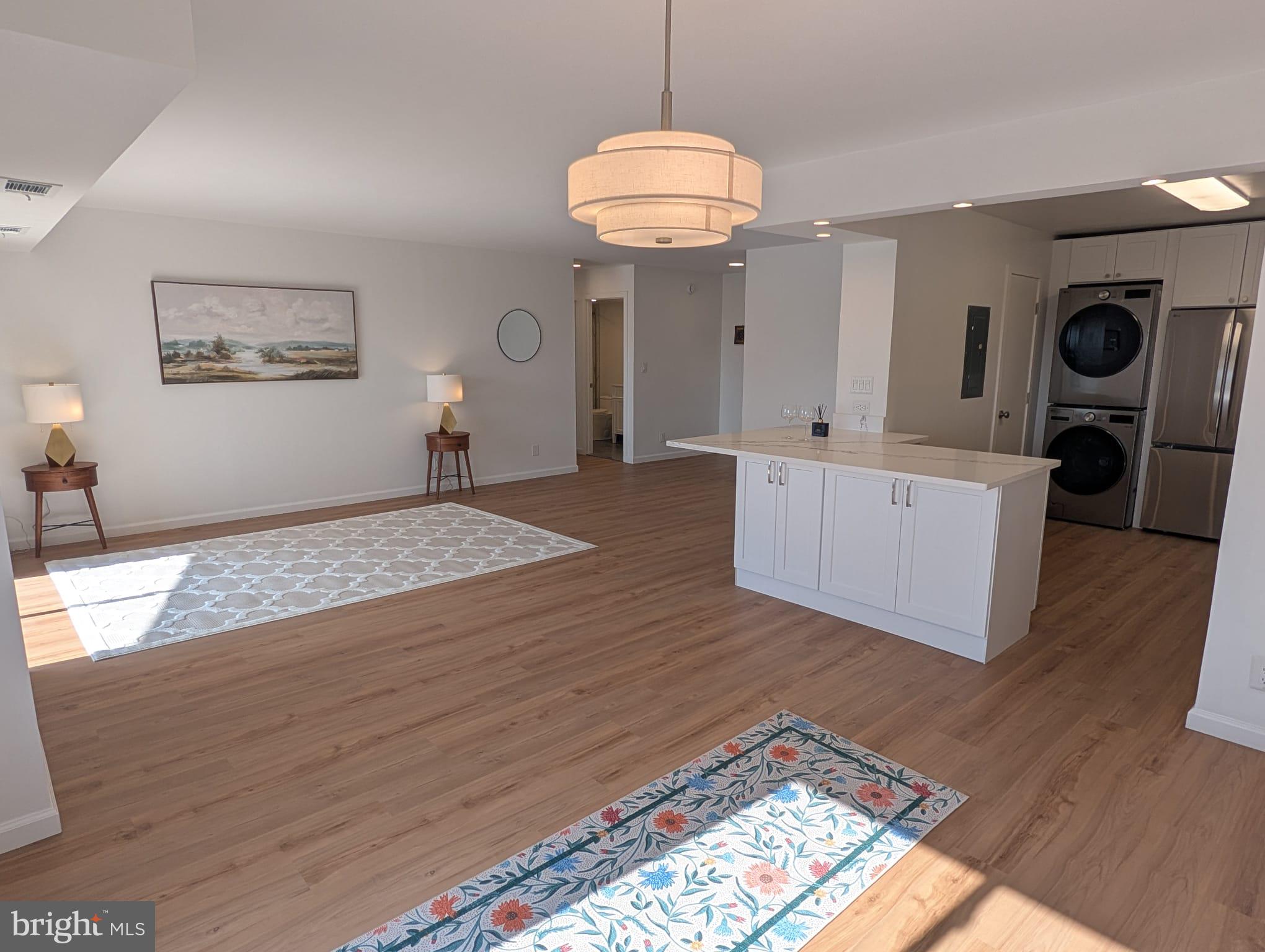 This is a modern 1-bedroom, 1-bathroom unit (992 SQ FT) in a professionally-maintained condominium community. The unit offers an open floor plan designed for comfortable living. The open kitchen features all new LG appliances, ample cabinets space, granite countertops, a large pantry, and a gorgeous kitchen island making the perfect setup for a an active kitchen and for entertaining guests. New in-unit LG washer/dryer, a spacious bedroom walk-in closet, and other lifestyle features in this unit, including new HVAC system, provide all you need to relax and enjoy your new home. The condominium association also offers a wealth of amenities, including indoor and outdoor swimming pools, a 2000 sq ft fitness center, vollyball, basketball, and tennis courts, picnic/grilling areas, dark park, putting area, and waking paths. The gated community with 24/7 security makes for a safe and comfortable enjoyment. With 2 allotted electronic parking passes for the unit owner, unlimited visitor parking passes, and EV charging stations in the parking lots, convenience is a priority at the Rotonda Condominium. This unit is in excellent condition. It is a perfect blend of comfort, luxury, and community.