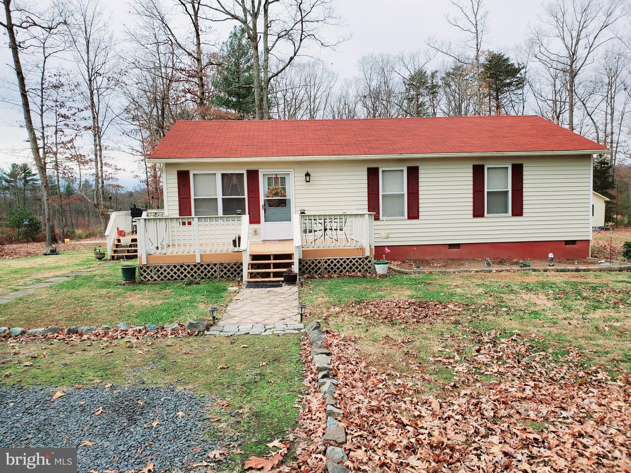 If privacy is what you're looking for then privacy is what you will get with this charming Rambler nestled in between mature hardwoods on 2.66 acres.  The property offers 3 bedrooms 1.5 baths with open concept, a front deck and a side deck. Plenty of room outside for out door entertaining. Utilize the two room shed as storage, She Shed or Man Cave. Grow your own veggies and herbs in the boxed in garden area. Endless opportunities with this property await you. Washer, Dryer and Freezer conveys with the property as well!