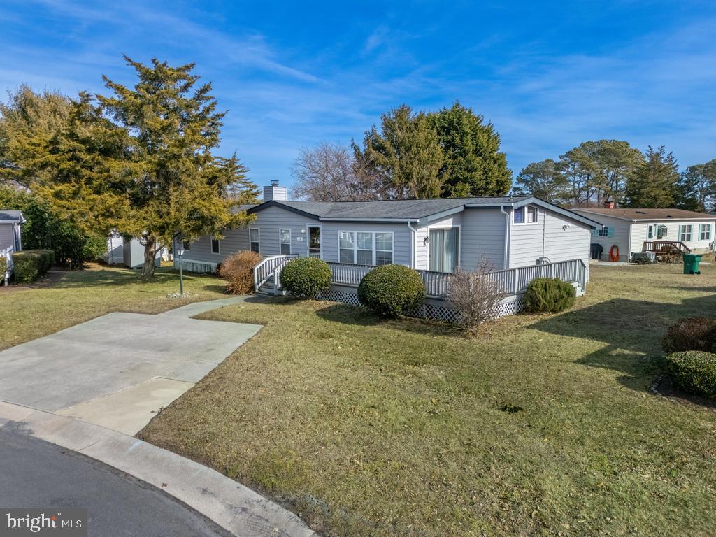 Motivated Seller!!  Welcome to this beautifully maintained 3 bedroom 3 bathroom home with the option for a 4th bedroom or additional living area. Perfect for guests,  a home office, or bonus room.  The inviting main living room features a cozy wood burning fireplace, ideal for relaxing on chilly evenings. The eat in kitchen offers plenty of space for meals and gatherings.  Two additional bedrooms provide comfortable accommodations.  Step outside to enjoy a huge back deck perfect for grilling or soaking up the sun.  The storage shed provides extra space for tools and seasonal items. Community offers a inground pool, basketball courts, tennis courts and a tots playground. Close to shopping, restaurants and beaches.