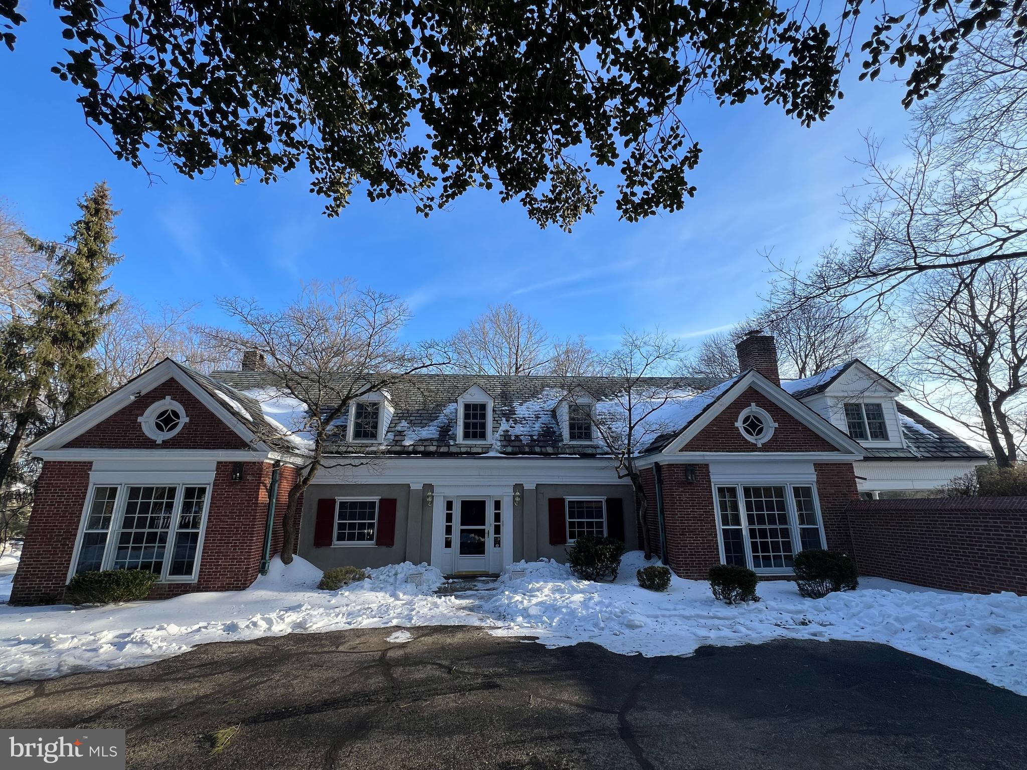 Classic Brick Main Line home with elegant brick courtyard.  Also included, additional lot behind the house, 441 Mulberry Lane.