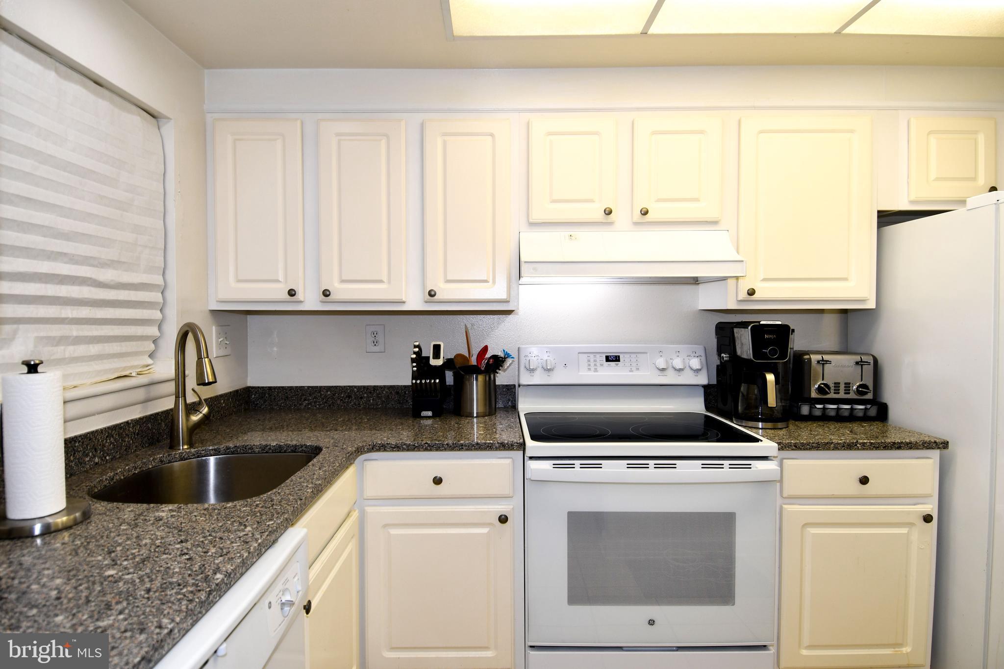 Short Sale - Has been approved by the bank for $180,000. Bank will not accept less.  Agents, please note that there is a Leisure World Contribution Fee that is 3% of the sale price and a $350 Membership Transfer Fee.Don't Miss Out on this Beautifully updated 2-bedroom, 2-bath condo in the gated 55+ Leisure World community of Silver Spring. This condo features an open floor plan, 2022 Thompson Creek windows and sliding glass doors, hot water heater 2021, Dishwasher 2021, A/C 2020, Stove 2023, Bathroom and Kitchen Faucets 2024, a bright & airy living and dining area, a functional kitchen, private oversized balcony, carport, ample closest for storage and extra storage unit. Enjoy resort-style amenities including clubhouses, golf course, swimming pools, fitness center, walking trails, movie theater, and more — all in a secure, active adult neighborhood.
