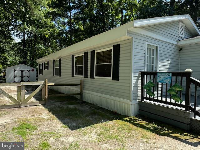 Land lease paid through June. Turnkey with 2025 New Roof and newer floors. Motivated Sellers. Please bring all offers. Amenities, Amenities, Amenities. 
Welcome to Your Secluded Paradise at Pot-Nets Bayside! Be in by Memorial Day and enjoy the entire summer.
Discover the ultimate beach and boating lifestyle in this immaculate three-bedroom, two-bath home, nestled in a tranquil setting surrounded by mature trees. Enjoy the luxury of privacy while being just a stone's throw away from all waterfront amenities.
Key Features:
Recent Upgrades: A new roof was installed in June 2025, along with new front and back storm doors. The back and front decks have been upgraded with durable Trex decking for low maintenance.
Spacious Living Areas: This home features a bonus living room, providing cozy spaces for relaxation and privacy. The open floor plan includes a sizable eat-in kitchen with modern stainless-steel appliances and ample room for a large dining table.
Accommodating Bedrooms: Three generously sized bedrooms ensure plenty of space for family and guests. A conveniently located, separately enclosed laundry room equipped with a large washer, dryer, and laundry tub adds to your convenience.
Outdoor Paradise: Step outside to a large, fenced yard—perfect for children and pets to play safely. Enjoy family barbecues in this outdoor oasis, complemented by ample parking for boats, golf carts, and cars. The large shed with electricity provides additional storage for your golf cart and equipment.
Community Amenities:
Located within the vibrant Pot-Nets Bayside community, you'll have direct access to the Indian River Inlet, private beaches, marinas, and a host of amenities. Enjoy two pools, scenic golf car paths, tennis courts, playgrounds, and endless outdoor activities, all surrounded by picturesque waterways.
Stroll or golf cart ride to the iconic Paradise Grill for delicious food, drinks, and live entertainment. With nearly 5 miles of waterfront, 800 boat slips, and a variety of recreational areas—including tennis/pickleball courts, basketball courts, and nature trails—there’s something for everyone to enjoy.  Join many family fun activities. 
Experience the joy of waterfront living in Pot-Nets Bayside, where generations of families have created lasting memories. Your new home awaits—embrace the perfect blend of recreation and relaxation!
Land rent, including refuse, is $1001.83 per month.