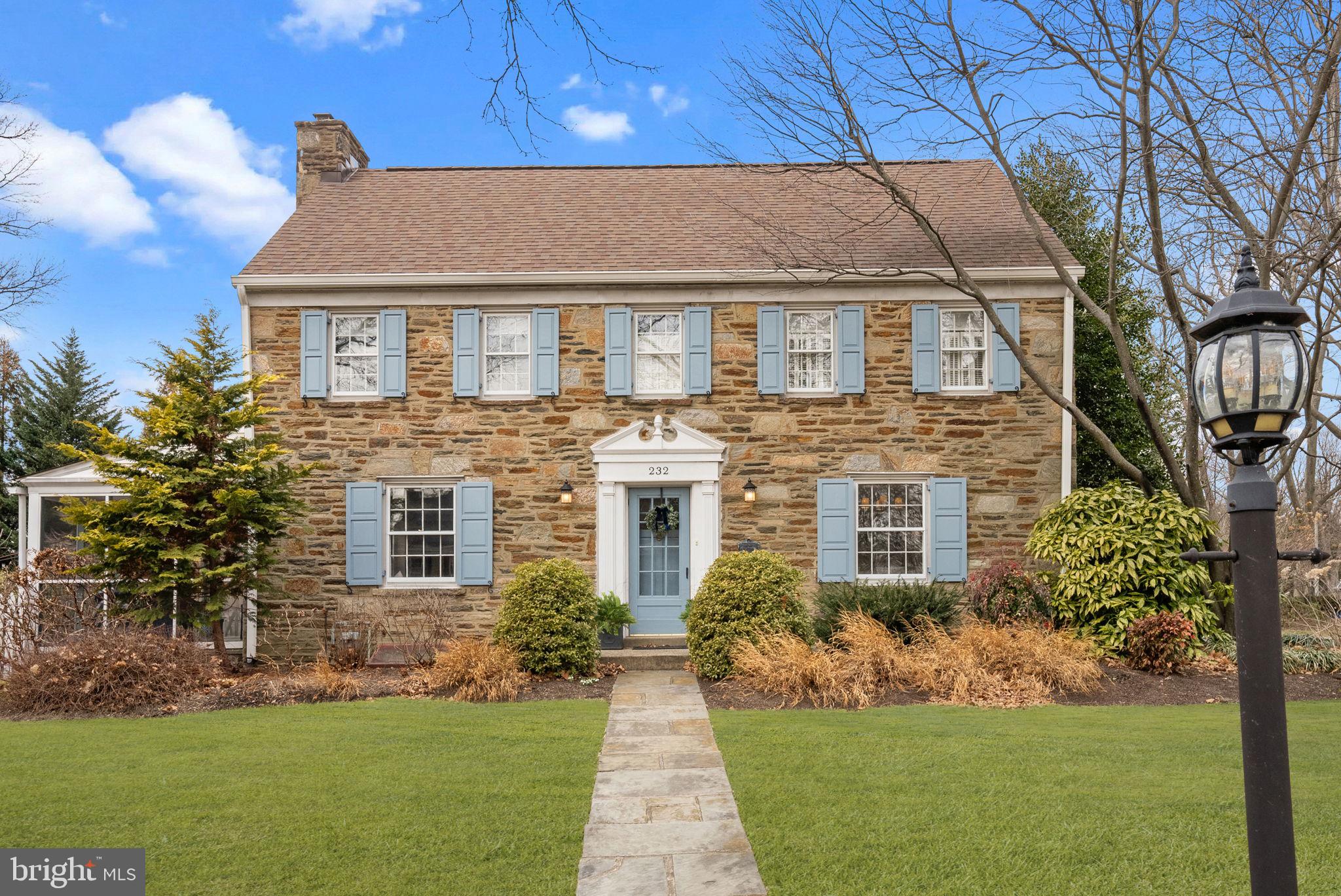 Welcome to 232 Fisher Road, a distinguished stone Colonial residence in the heart of the highly sought after neighborhood, Jenkintown Manor, a family friendly neighborhood known for its tree lined streets and walkable sidewalks.  This home artfully combines timeless elegance and classic charm with modern comforts. This 5 bedroom, 3.5 bathroom well appointed home is in impeccable condition, offering an expansive 2,696 square feet of living space, set on a generous 10,656 square foot lot, providing ample room for both indoor and outdoor activities and entertaining.  The gourmet eat-in kitchen with high end cabinetry and recently updated quartz countertops features a doublewall-in oven with warming drawer, wine refrigerator, and an updated gas range.  Adjacent to the kitchen is the elegant dining room which features a large bay window and which was recently updated with crown and wall moulding.  The large inviting living room, recently updated to include custom built in bookshelves and cabinetry, and featuring a wood burning fireplace is the perfect spot for cozy evenings or entertaining. Off of this living room, step onto the screened in porch, a cosy indoor/outdoor living space looking out the well maintained, mature garden.  The family room boasts custom built ins and a gas fireplace.  A half bath completes the first floor. Two staircases lead to the second floor which features a large master bedroom with walk in closets and an en suite.  Four additional bedrooms, one of which features an en suite bathroom and is currently being used as an at home office, and a hall bath complete the second floor.  The basement is currently unfinished but is used for storage, laundry, and as a work out space.  Additional storage is offered in the attic. The mature gardens have been beautifully landscaped and well maintained and include a fenced in vegetable garden recently updated with new planters and pea gravel.  New white picket fencing, including trellis, was recently added to the gardens. Wa Beautiful hardwood floors throughout, freshly painted, and arecently updated central air HVAC system, this home caters to all your needs. Experience the harmonious blend of sophistication and comfort that 232 Fisher Road offers, making it the perfect sanctuary to call home. Walkable distance to Alverthorpe Park and Abington Art Center. Award winning Abington School District. Close proximity to shopping, restaurants, train to Philadelphia.. **ALL SHOWINGS WILL BEGIN AT THE OPEN HOUSE APRIL 4 & 5 4:00 - 7:00PM