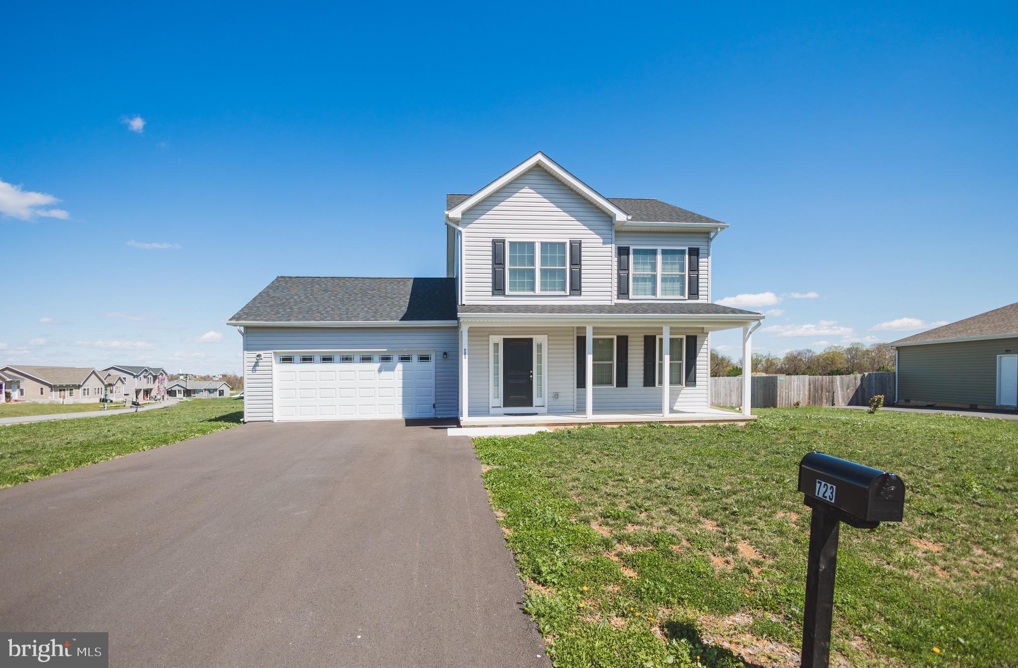 723 Duckwoods Lane in Martinsburg, WV 25403, is a single-family Colonial-style home featuring 3 bedrooms, 2.5 bathrooms, and approximately 1,693 square feet of living space. Constructed in 2023, this home boasts luxury vinyl plank (LVP) flooring throughout the main living areas and hallways, with carpeting in the bedrooms. The gourmet kitchen is equipped with granite countertops, an island, and Whirlpool stainless steel appliances. The property also includes a two-car garage. Schedule your showing today as you will not want to miss this one.