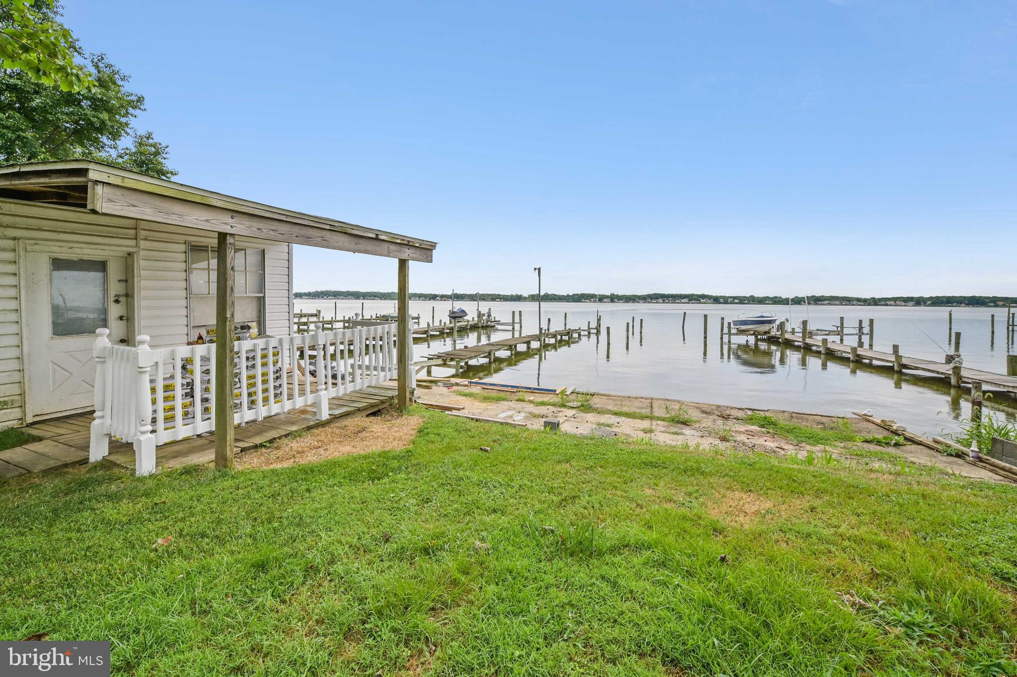 Waterfront living at it's best! Welcome home to this adorable move-in ready bungalow style home peacefully situated on the Back River in Essex. This charming home features 4 bedrooms and 1.5 baths, spacious front and back yards, 2 boat slips, a large eat in kitchen, hardwoods throughout, and amazing waterfront views. New living room carpet, freshly painted, newer roof and HVAC. Book your showing today!
