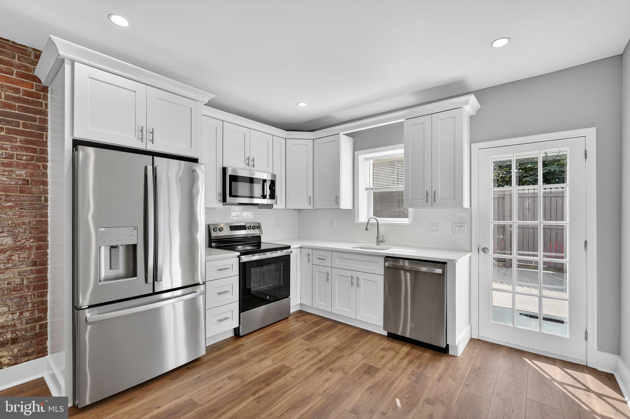 Welcome to this beautifully renovated 2-bedroom, 1-bathroom home combining modern style with classic charm. The open-concept main level features an exposed brick accent wall, custom iron railings, and a brand-new kitchen with high-end finishes, stainless steel appliances, and sleek cabinetry. The stunning bathroom offers a stand-up shower with a custom sliding glass door. Enjoy extra living space in the finished basement and a private outdoor area with new concrete. Additional upgrades include new windows, HVAC, and contemporary lighting throughout. Ideally located within walking distance to Tacconelli’s, Kitty’s, and Nemi—this home blends comfort, craftsmanship, and convenience in one perfect package.