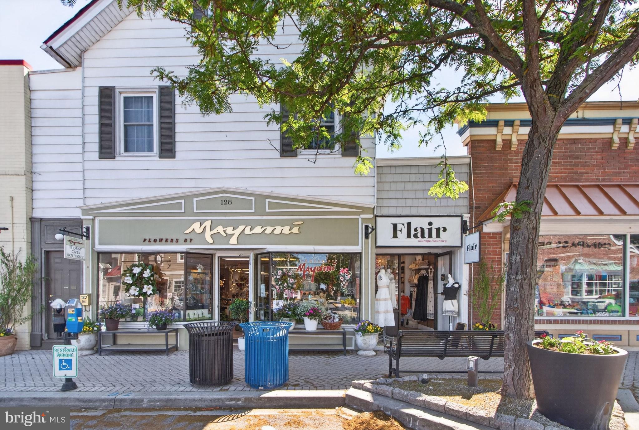 Rare investment opportunity in the heart of Historic Lewes, Delaware. Situated on picturesque Second Street in one of the area's most desirable and walk-able commercial districts, this mixed-use property offers a unique combination of retail and residential income in a premier downtown location. The building consists of four fully leased units, including two commercial spaces on the first floor and two residential apartments on the second floor. Unit 128 is occupied by a well-established florist, while Unit 130 serves as a retail storefront. Above, Unit 126 is a spacious two-bedroom, one-bath apartment with a private entrance from Second Street, and Unit 121 is a studio apartment with separate rear access.  All four units are fully rented, generating approximately $74,000 in annual rental income. Sale includes real estate only; businesses are not included in the transaction.  Positioned just blocks from the Lewes-Rehoboth Canal, Delaware Bay beaches, restaurants, shops, and attractions, this property offers investors the opportunity to own a fully occupied income-producing asset in one of Delaware's most sought-after coastal markets. Whether expanding an investment portfolio or securing a landmark downtown property with long-term appreciation potential, opportunities like this are rarely available in Historic Lewes.