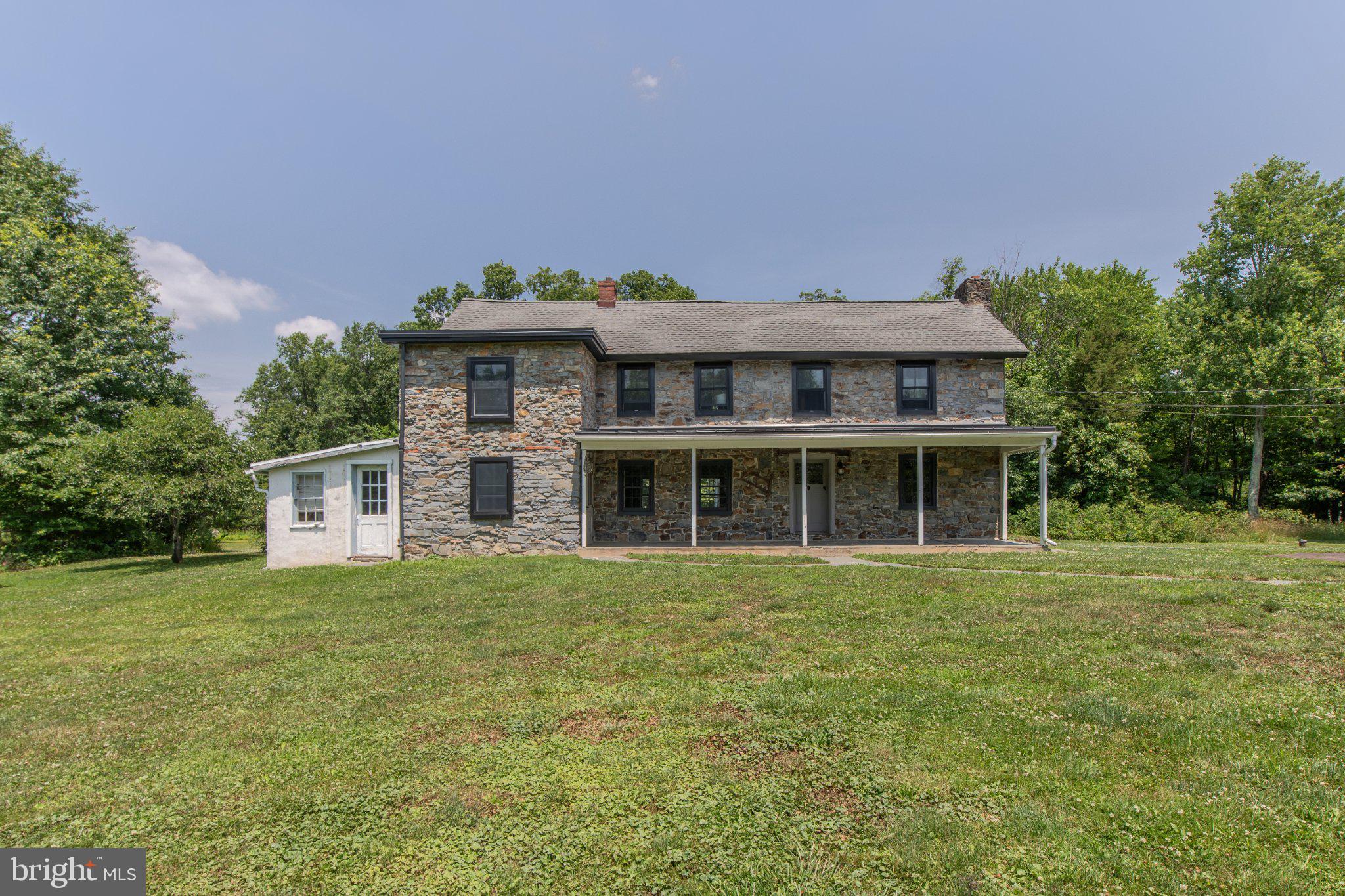 Step back in time with this truly one-of-a-kind 1800s farmhouse nestled on 11 picturesque acres in the desirable Quakertown School District. Rich in history and overflowing with character, this exceptional property offers 3 bedrooms, 2 full baths, and timeless craftsmanship throughout.
The majority of the home features original wide-plank hardwood floors, preserving the authentic charm of this historic residence. Two stunning stone wood-burning fireplaces create warm and inviting gathering spaces, including a spectacular family room showcasing exposed wood beams and rustic architectural details. The dining room is a showstopper with its original stone walls, providing an unforgettable setting for everyday meals and entertaining.
Outside, a you'll find a inground pool and a large barn that adds endless possibilities for storage, hobbies, animals, or future use, all surrounded by 11 scenic acres of peaceful Bucks County countryside.
Rarely does a property of this caliber become available. Combining historic beauty, acreage, and a highly sought-after location, this remarkable farmhouse offers a unique opportunity to own a piece of history while enjoying the space and privacy of country living.