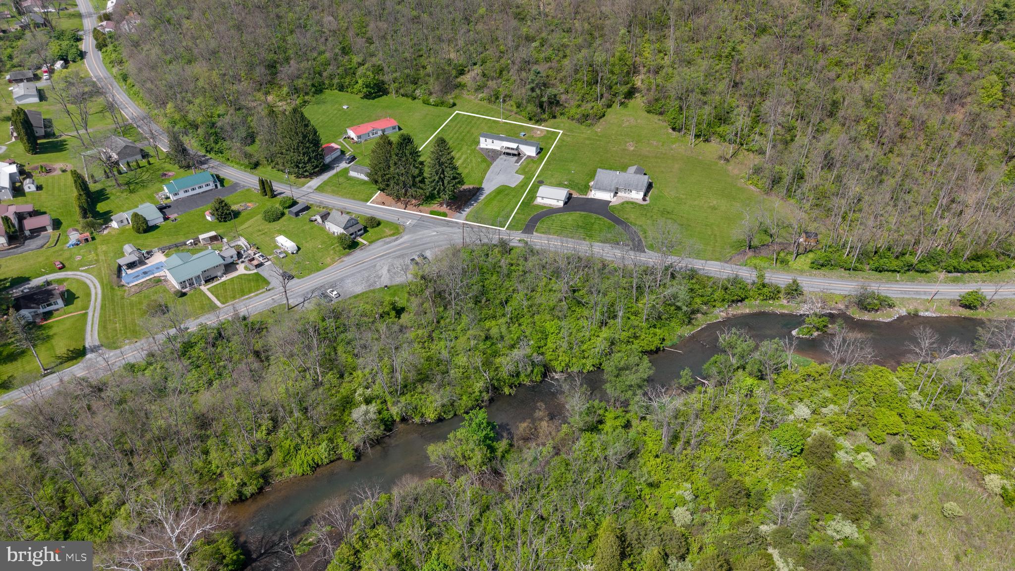 Fisherman’s Delight in Happy Valley – Steps from Spring Creek! Escape to your own private retreat in the heart of Central Pennsylvania! Nestled on a peaceful and secluded 0.9-acre lot, this well-maintained 1996 Skyline 14x80 mobile home offers the perfect combination of comfort, convenience, and outdoor recreation. Located just steps away from renowned Spring Creek — a Class A wild trout stream — this property is truly a fisherman’s dream. Whether you’re looking for a full-time residence, weekend getaway, or investment opportunity, this scenic property delivers. Inside, you’ll find 1,120 square feet of spacious living, featuring 2 bedrooms and 2 full baths, a large open living area, a spacious kitchen with ample cabinet space, and a large covered front porch perfect for relaxing, entertaining, or enjoying the view. The home sits on a full unfinished basement offering endless possibilities for storage, workshop space, or more. Enjoy the beauty and recreation of Central PA while staying close to everything: just 15 minutes to downtown State College, 5 minutes to downtown Bellefonte, and conveniently located near Penn State, shopping, dining, and outdoor activities. If you’ve been searching for a country setting with world-class trout fishing right outside your door, this secluded Happy Valley retreat is a rare find! Seller is a PA-licensed Realtor.