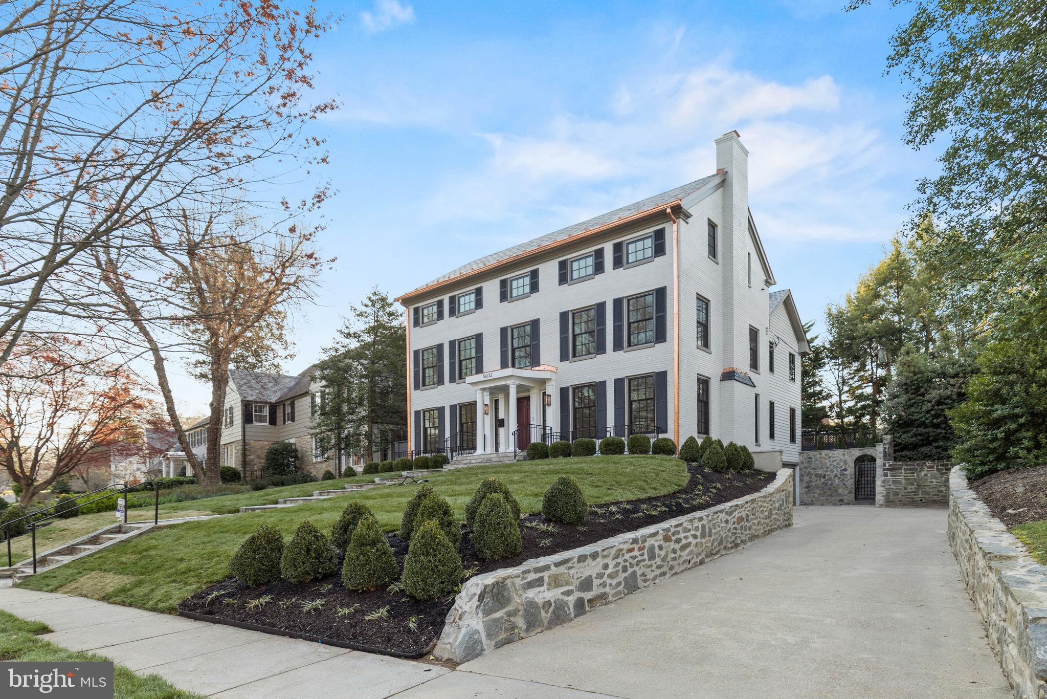***FOR COMP PURPOSES *** Few names evoke ideas of masterful design in Washington as Christian Zapatka, one of the city’s preeminent architects responsible for some of its most distinguished residences. In a collaboration with the visionary Dilan Homes, 5032 Tilden Street NW stands at the forefront of a movement to revitalize Washginton’s streetscapes. A complete reinvention of a classic Spring Valley colonial prominently perched above the winding tree-lined street, the home retains its original 1939 character while being propelled into the demanding modern era. With the addition of an entirely new top level, the home’s dramatic curb appeal is bolstered by a combination of slate and contemporary metal roofing, representing the union of old and new throughout. Inside, the new floor plan is fully open concept and comprises only the highest caliber of finishes, but still retains a traditional center hall layout befitting the home’s pedigree. Formal living and dining rooms flank the ethereal foyer hall, spanning the entire depth of the original floor plan. In the living room, a roaring fireplace serves as the centerpiece, while the dining room features a butler’s pantry discreetly tucked behind a swinging door, affording direct connection to the kitchen. A central vestibule serves as the gateway between formal and informal areas, of which the latter is situated in an entirely new wing. The space fully caters towards a modern lifestyle, with the open kitchen anchored by an expansive center island with integrated seating. The large family room opens directly onto the rear lawn via double doors, enabling a seamless flow of indoor and outdoor entertaining. Above this space on the second level is the sumptuous primary suite opening onto a private terrace overlooking the rear lawn. Luxurious amenities abound, including a lavish bath replete with twin vanities, freestanding soaking tub, glass shower and water closet. Double walk-in closets lined with custom built-ins offer ample, stylish storage. Two secondary bedrooms, each generously proportioned and featuring both walk-in closets as well as ensuite baths, complete the level. On the newly added top floor, a large central recreation room serves limitless purposes. A fourth bedroom suite and two hobby rooms greatly enhance flexibility. The new attached two-car garage accesses the lower level and is a rarity in the city. Out back, a stone terrace takes full advantage of the premier flat, usable, private rear lawn. Led by a distinguished team and built to the highest standards, 5032 Tilden Street NW stands at the pinnacle of Spring Valley.