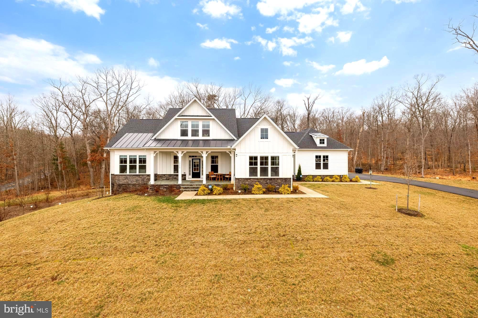 A rare opportunity to own a custom-built home on 5 private acres in Clifton. This exceptional 4-bedroom, 4.5-bath residence blends refined design, high-end finishes, and a highly desirable main-level owner’s suite. Rarely available in Clifton, this home offers an incredible combination of luxury, space, and thoughtful design.
A grand entry sets the tone with coffered ceilings and wide-plank hardwood floors that flow seamlessly throughout the main level. The home feels both elegant and inviting, thoughtfully designed for comfortable everyday living as well as elevated entertaining. The main level features the primary suite, a private office, and an enclosed deck—providing versatile living all on one level.
The primary suite is a true retreat, featuring a double-door entry, dramatic floor-to-ceiling windows, and a spa-inspired en-suite bath with a freestanding soaking tub, dual vanities, and an oversized walk-in shower with built-in seating. An expansive walk-in closet completes the space. Each additional bedroom is generously sized and offers abundant closet space, allowing for flexibility to fit a variety of needs.
The lower level expands the home’s living space even further. Two bonus rooms provide excellent options for storage, a movie theater, or additional bedrooms. The basement also includes a custom home gym, an additional bedroom, and an impressive open recreation area perfect for entertaining or relaxing.
Set on five private acres, this property offers the rare combination of luxury, privacy, and tranquility—just minutes from the charm of historic Clifton.
Ideally located near Twin Lakes Golf Course, parks, grocery stores, major commuter routes, fine dining, and much more.