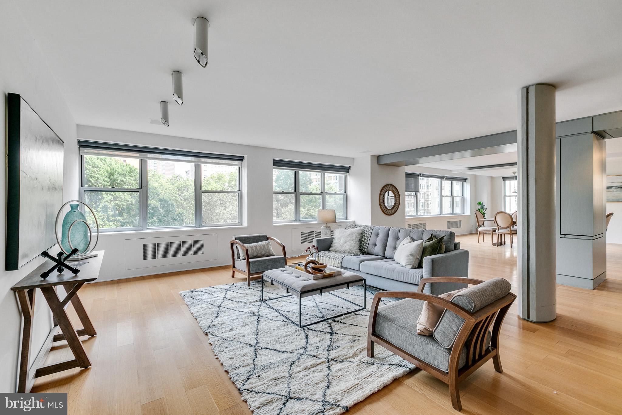 Here is an excellent opportunity to own a tremendous amount of space in one of the finest urban locations in the country, Rittenhouse Square! You can enjoy the current open layout or you can customize to your own desires. This spectacular space is a combination of three units and offers three exposures, walls of windows, great light and spans the entire front of the building. To the east you will enjoy the most amazing treetop views of Rittenhouse Square that you will ever see. Currently set up as a 2 bedroom, 3.5 bath with a separate den / office area which could be converted into a third bedroom. The kitchen is open to the dining area and offers generous modern cabinetry, high-end appliances, marble backsplash, stainless steel counters and a perfectly placed prep sink plus breakfast bar, not to mention the convenient half bath. The first spacious primary en-suite bedroom features a wall of closets, built-ins and a spa-like marble bath with a stall shower and Jacuzzi tub. Next you will find a large office / den with views of Rittenhouse and a full marble bath. The 2nd primary en-suite bedroom has gorgeous views, hardwood floors, built-in benches and custom lighting. The enormous walk-in closet features a laundry area and another marble spa-like bath with privacy glass. At the rear of the closet, you will find a cedar closet for your off season storage needs and a separate office space in the back corner. Residents enjoy 24-hour services, gym, a classy and comfortable lobby and a gracious full time doorman and staff. This home is a one-of-a-kind, designed by award-winning architect Wesley Wei at the highly sought after Two Twenty West Rittenhouse; a boutique building that is located on the west side of Rittenhouse Square. The seller is offering 1 year prepaid parking at a nearby garage.