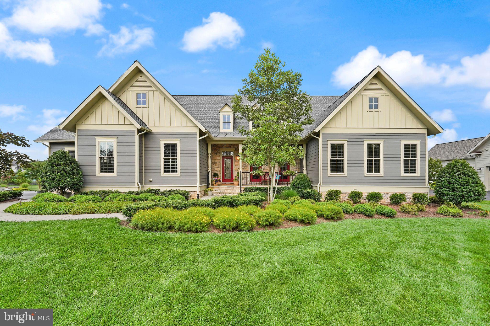 Where Architectural Elegance Meets Inspired Living

Welcome to The Kavanagh, a singular expression of luxury and design, nestled on nearly an acre of pristine landscape in the coveted community of The Grant at Willowsford. This exceptional one-level residence is more than just a home—it’s a lifestyle, meticulously crafted for those who appreciate both refined beauty and modern ease.

From the moment you step inside, natural light pours across gleaming hardwood floors and dances along the 10-foot ceilings, casting a golden glow on every thoughtful detail. An open, airy floor plan offers uninterrupted sightlines from the stately front entrance to the lush backyard, evoking a sense of calm and effortless grandeur.

The gourmet kitchen is a chef’s dream, complete with a custom built-in banquet and exquisite finishes that blend style with function. Two elegant stone gas fireplaces provide a warm embrace—whether you're enjoying a quiet evening or entertaining in grand style.

Beyond the main level, the full walk-out lower level stuns with rare 10-foot ceilings, a custom-designed bar, and direct access to a sweeping slate patio that spans the width of the home. Host alfresco soirées around the built-in outdoor BBQ or unwind in the serenity of your private outdoor oasis.

Throughout the home, elevated features abound:
• Frameless glass shower and heated, jetted tub in the owner's spa bath
• Two expansive exterior decks for seamless indoor-outdoor flow
• Leaded glass front door, adding a stately first impression
• Built-in bookshelves in the library and family room—ideal for art, literature, or curated treasures
• Epoxy-sealed and painted 3-car garage and basement storage with oversized built-in shelving
• A 2024 new roof with transferrable warranty—peace of mind, built-in
|
Items That Convey: Pool table & accessories, buffalo print in stairwell, custom rugs (dining room & front library), all custom blinds, drapes & panels, custom kitchen banquette cushions, BR #3 gray custom headboard, BR #2 custom throw, 2 printed pillows, khaki coverlet, shams & dust ruffle, 4 kitchen island stools, and 9’ Christmas tree (stored in basement).
|
The Kavanagh isn’t just impeccably built; it’s intentionally designed for the way you want to live—where form meets function, and every corner reflects a commitment to excellence.
Come experience the difference. Your next chapter begins here.