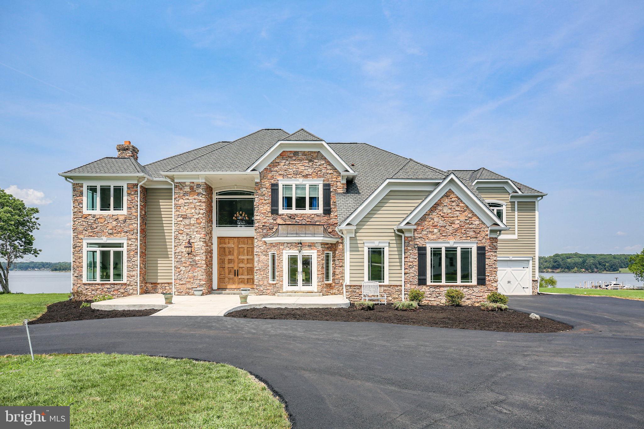 Nestled within the serene enclave of Loy Landing, this exquisite Colonial-style residence offers a harmonious blend of luxury and comfort, perfectly situated on a sprawling 3.53-acre lot with an impressive 250 feet of direct Aquia Creek frontage. The property invites you to experience an exclusive lifestyle, where every detail has been thoughtfully curated to enhance your living experience. Step inside to discover a warm and inviting interior that seamlessly combines elegance with functionality. The heart of the home features a spacious custom gourmet kitchen, complete with an island and ample table space, separate stand alone refrigerator and freezer, commercial range top with a four burner flat top griddle and a grill, ideal for both casual dining and entertaining. Ten foot ceiling on the main level and twenty three foot ceilings in the family room. The open layout encourages a natural flow between the kitchen and living areas, where a cozy fireplace serves as a focal point, creating a perfect ambiance for gatherings or quiet evenings at home. With four generously sized bedrooms and three full bathrooms plus two  convenient half baths, this residence provides ample space for relaxation and privacy. The unfinished basement, accessible via a connecting stairway, offers endless possibilities for customization, whether you envision a personal gym, a home theater, or additional living space. The allure of this property extends beyond its walls. Step outside to embrace the breathtaking water views that define this home. The proximity to the Potomac River allows for a variety of water-oriented activities, including boating, fishing, and swimming, all just a stone's throw away. Enjoy private access to Aquia Creek, where you can launch your canoe or kayak, or simply unwind by the water's edge, soaking in the tranquil surroundings. The expansive outdoor space is perfect for hosting summer barbecues or simply enjoying the natural beauty that envelops the property. With an attached garage accommodating up to five vehicles, convenience is at your fingertips, ensuring that your lifestyle remains uninterrupted. This residence is not just a home; it's a sanctuary that offers a unique blend of luxury, comfort, and an unparalleled connection to nature. Experience the best of waterfront living in a setting that feels both exclusive and inviting, where every day feels like a retreat. Home is minutes from the Brooke VRE, The Crows Nest Nature Preserve and the Civil War Park. Embrace the lifestyle you've always dreamed of in this remarkable property. See documents section for list of upgrades, it is infinite!