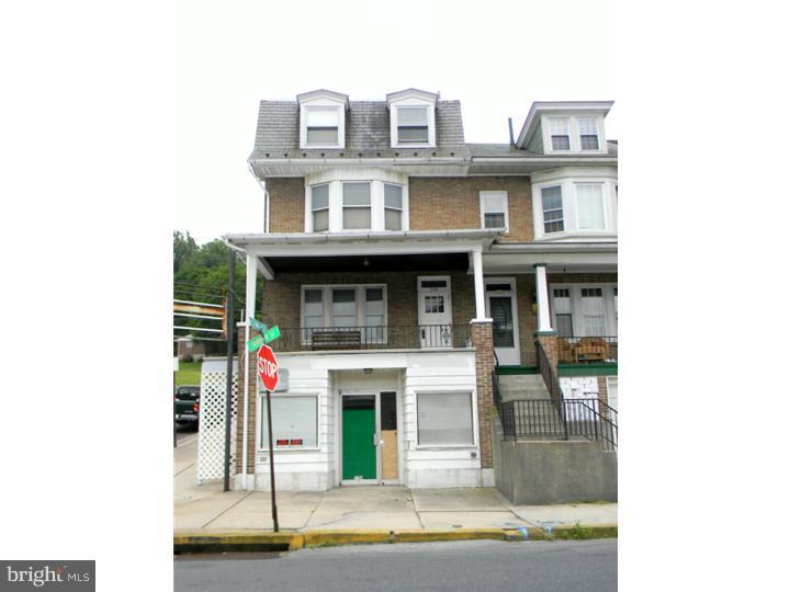 Spacious 4 bedroom, 2 bath - 2nd/3rd floors, 1st floor one bedroom unit, 1st floor basement area. Store front - can not be rented unit - you can get a variance from City of Reading - cost $800 - has been sandwich shop. This property has a little deferred maintenance - but is a nice corner property with 2-story garage for storage. Great for owner occupant.