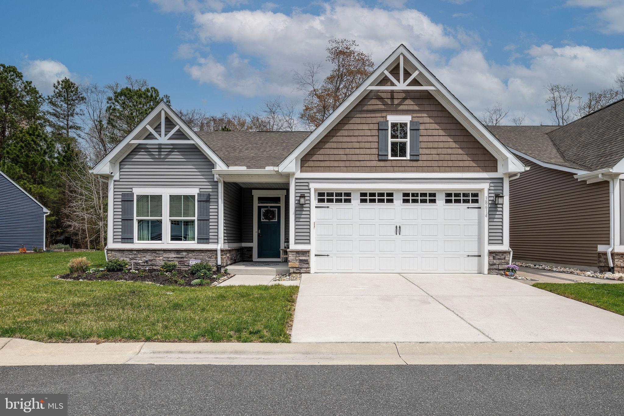 Welcome to 38614 Bitternut Hickory Way Unit #68, Ocean View, DE 19970-4010. This like new home was built in 2018 and shows better than new still. The home features 3 nice size bedrooms, 2 full baths. The kitchen is next to the great room, the kitchen features a center island, granite counter tops and white cabinetry with stainless appliances. The great room features a nice propane fireplace for those chilly fall evenings.   Covered porch (10 by 12) with outside ceiling fan, gutter guards, EP Henry paver patio next to covered porch.  The garage is oversized with plenty of space for your car and beach toys. Bethany Beach is right up the road, along with excellent dining and shopping. The condo fee includes all exterior maintenance, grass cutting, swimming pools, irrigation system, and even power washing.