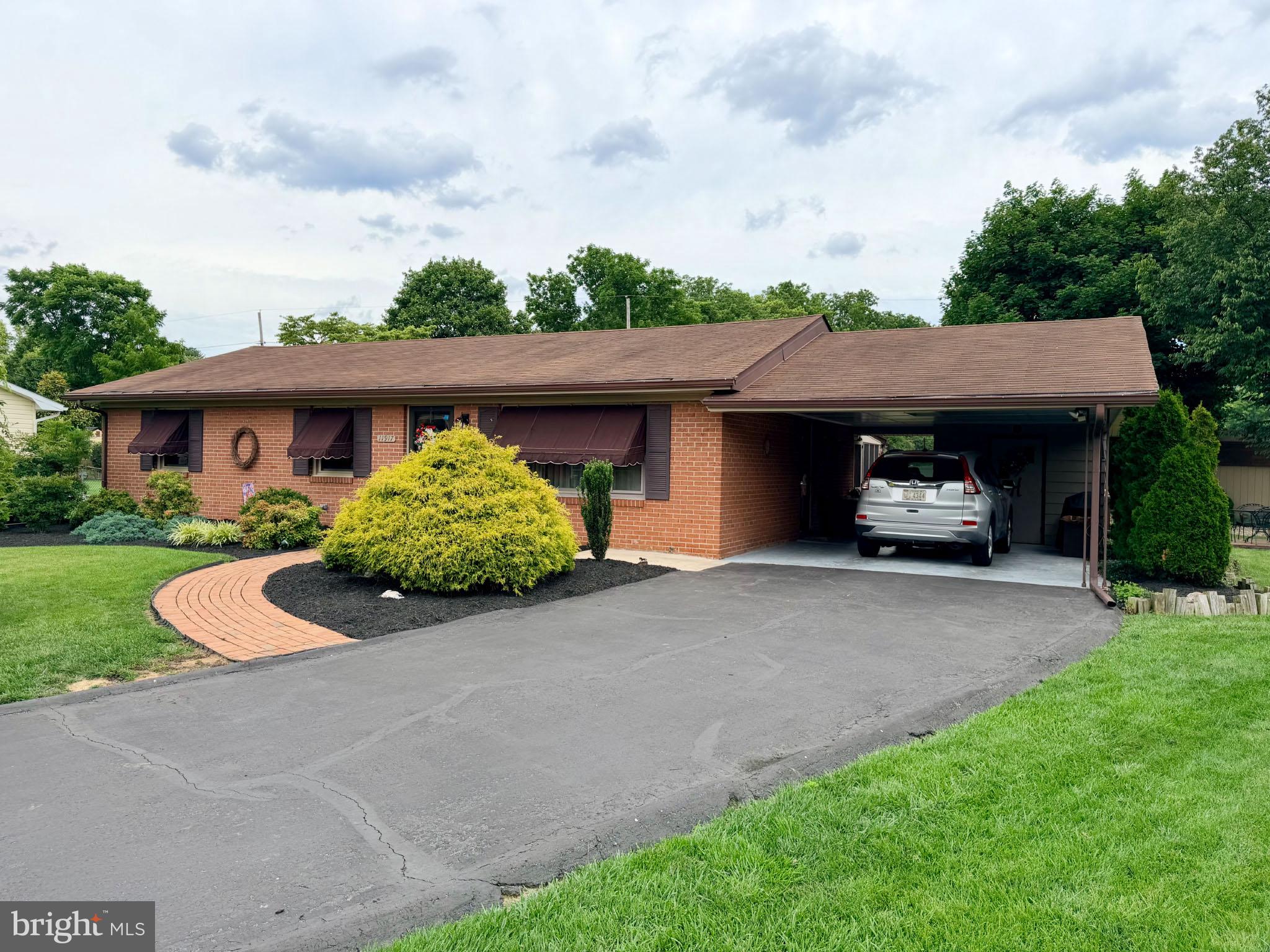 Beautiful  very well maintained inside and out brick rancher located in Greenvale Village, Smithsburg!  Original owner.  Smithsburg Schools!  Extensive landscaping from front to back!  Entering the home you'll find a living room, with picture window.  Charming eat-in kitchen renovated by J&D Kitchens, soft closing custom cherry cabinets, stone countertops, stainless steel appliance.  The main floor offers a full bathroom,  a primary bedroom, 2 additional bedrooms.  The full finished walk-out basement includes a spacious family room with bar, storage room, and laundry/utility room.    Enjoy relaxing and entertaining on the screened porch and multiple decks.  The backyard offers so much space, with a beautiful view!  Large shed shop with electric, smaller shed for lawn equipment and gardening tools.  Don't miss this wonderful opportunity to make this amazing home yours!