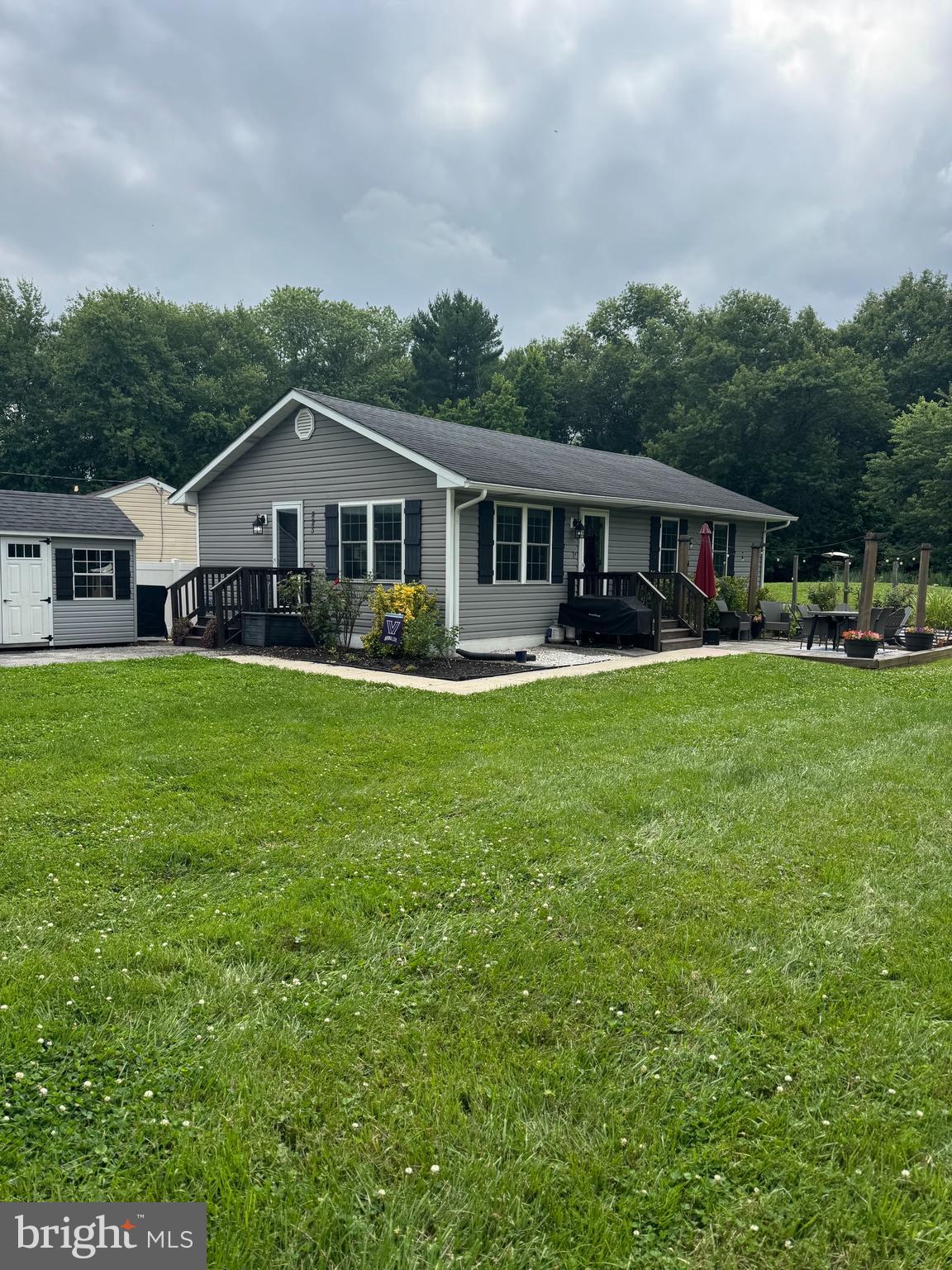 Opportunities like this are becoming increasingly rare in Middletown.
     Charming single-family residence in Middletown, offered at an exceptional value of $329,900. Nestled on a peaceful third-acre lot that backs to mature woods, this inviting one-level home blends comfort, privacy, and convenience.
     Inside, you’ll find three bedrooms, one full bath, a spacious living room, and an eat-in kitchen featuring stainless steel appliances, along with the convenience of first-floor laundry.
Recent updates and added features include beautiful wood floors, a water conditioner and filtration system, newer windows with blinds, four ceiling fans, a sump pump in the crawl space, outdoor lighting, and pull-down attic stairs leading to additional attic storage.
     Step outside to the beautiful stone patio type area, perfect for relaxing, entertaining, fire pit or enjoying the tranquil wooded setting, while the large shed provides ample storage for all your needs.
The septic system has also been certified, offering added confidence and peace of mind. An added bonus is that there are no water or sewer bills and no city taxes, helping keep monthly ownership costs lower.
     Whether you’re a first-time homebuyer, a young professional, downsizing, or simply looking for the ease of single-level living, this home offers a warm and welcoming space to make your own.
Ideally located just moments from Summit Bridge, with easy access to I-95, Route 40, Bear, and all the shopping, dining, and everyday conveniences of both Middletown and Bear—including the newly built Weis Market—you’ll enjoy the best of both worlds: a quiet, tucked-away setting with everything you need just minutes away.
     Don’t miss your chance to own this delightful home and enjoy all it has to offer
     For eligible buyers, USDA financing with zero money down is available, making the path to homeownership even more accessible.
Contingent upon sellers finding new home. Sellers actively looking and have found home they are interested in.